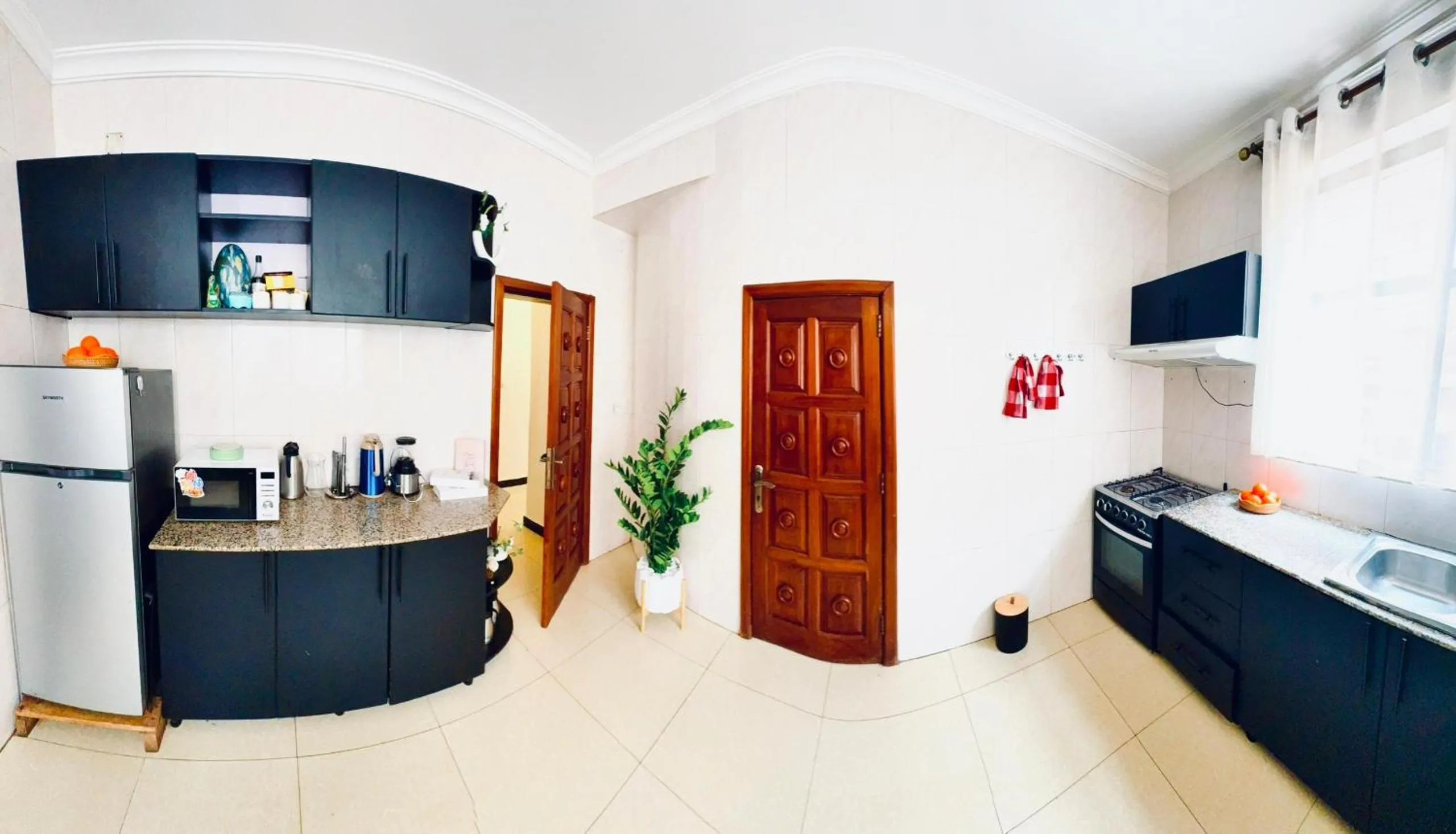 Kitchen or kitchenette in kigali Pillar House inn