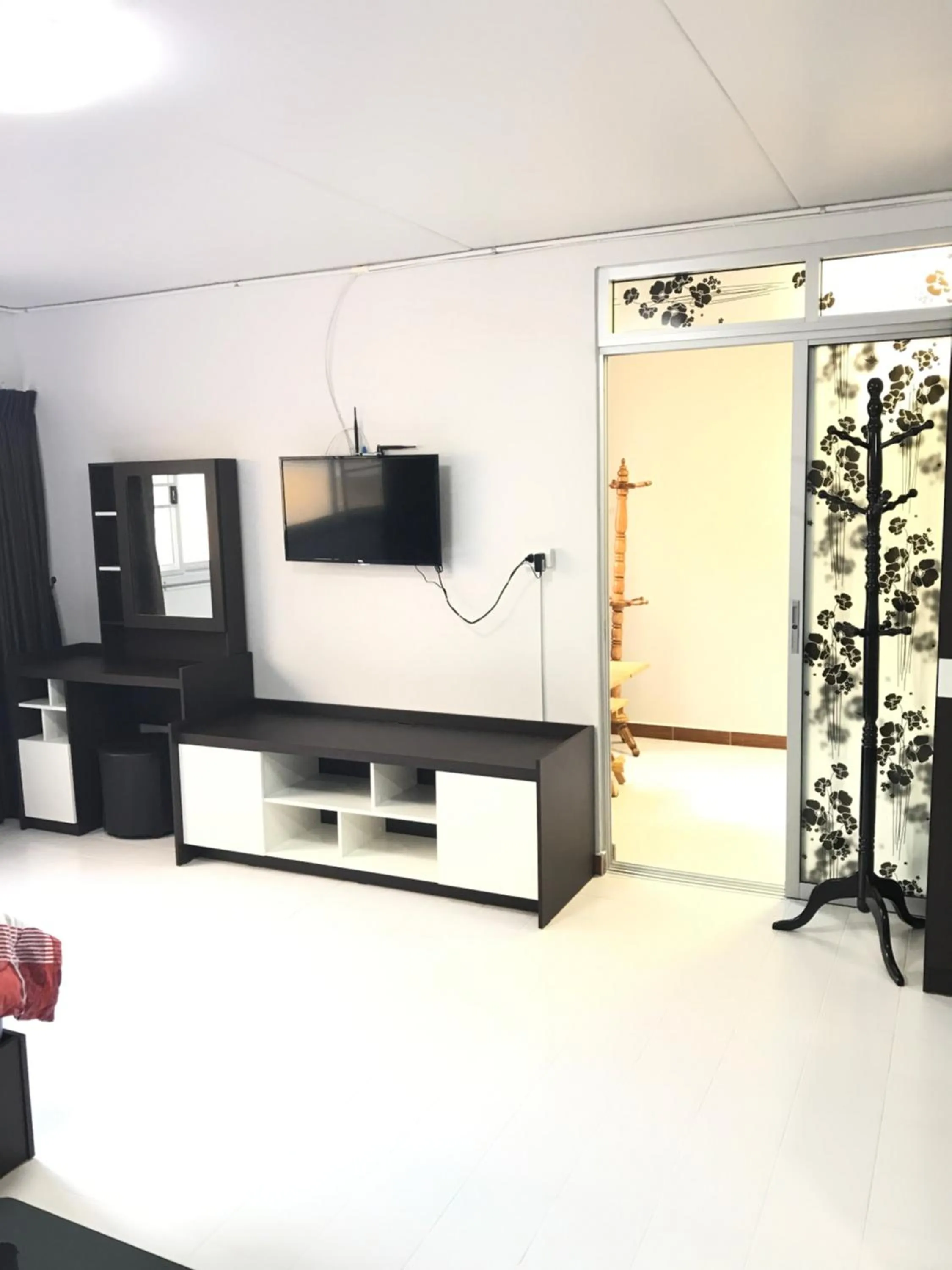 Communal lounge/ TV room in Muangthongthani Rental/Khun Dan