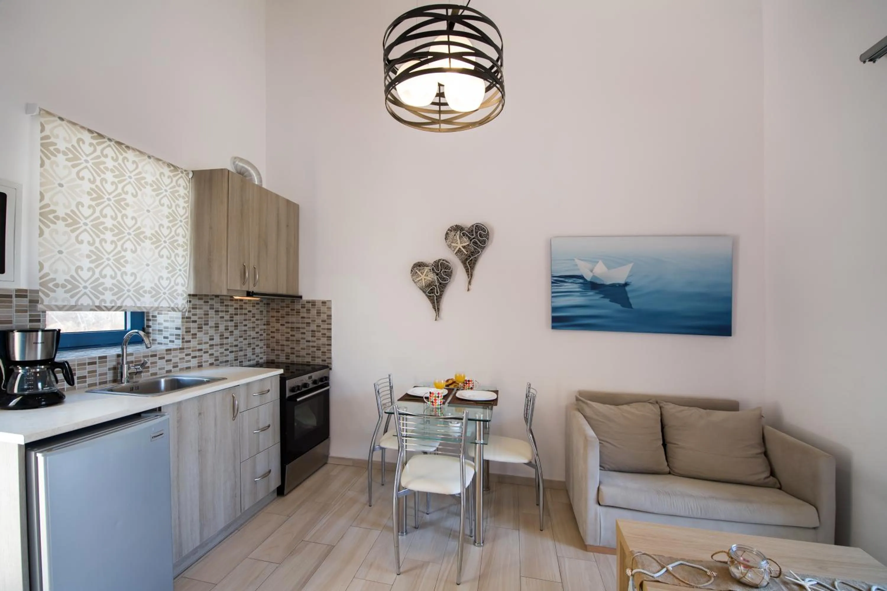 Kitchen or kitchenette in Ilianthos Apartments & Rooms