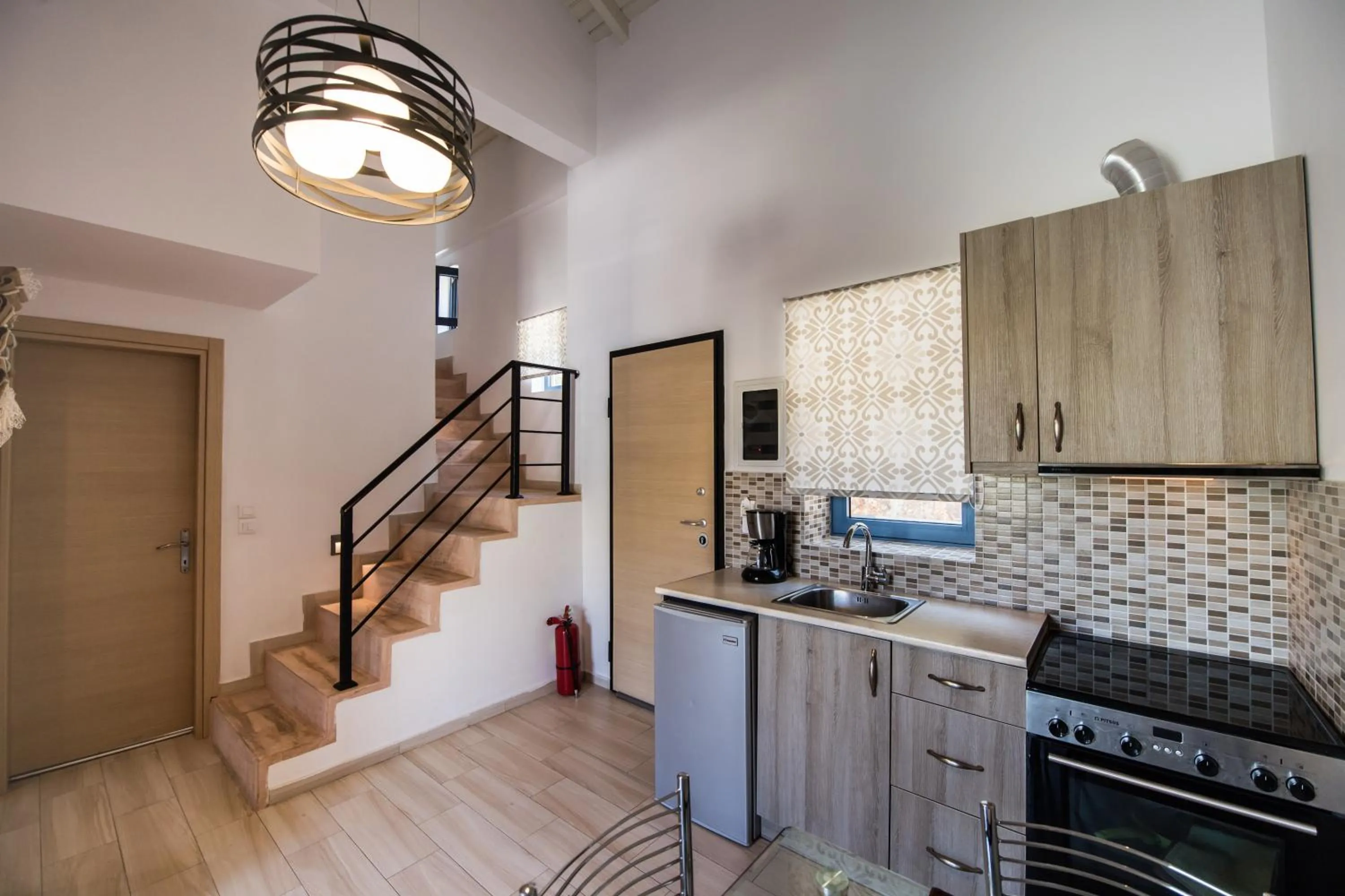 Kitchen or kitchenette in Ilianthos Apartments & Rooms