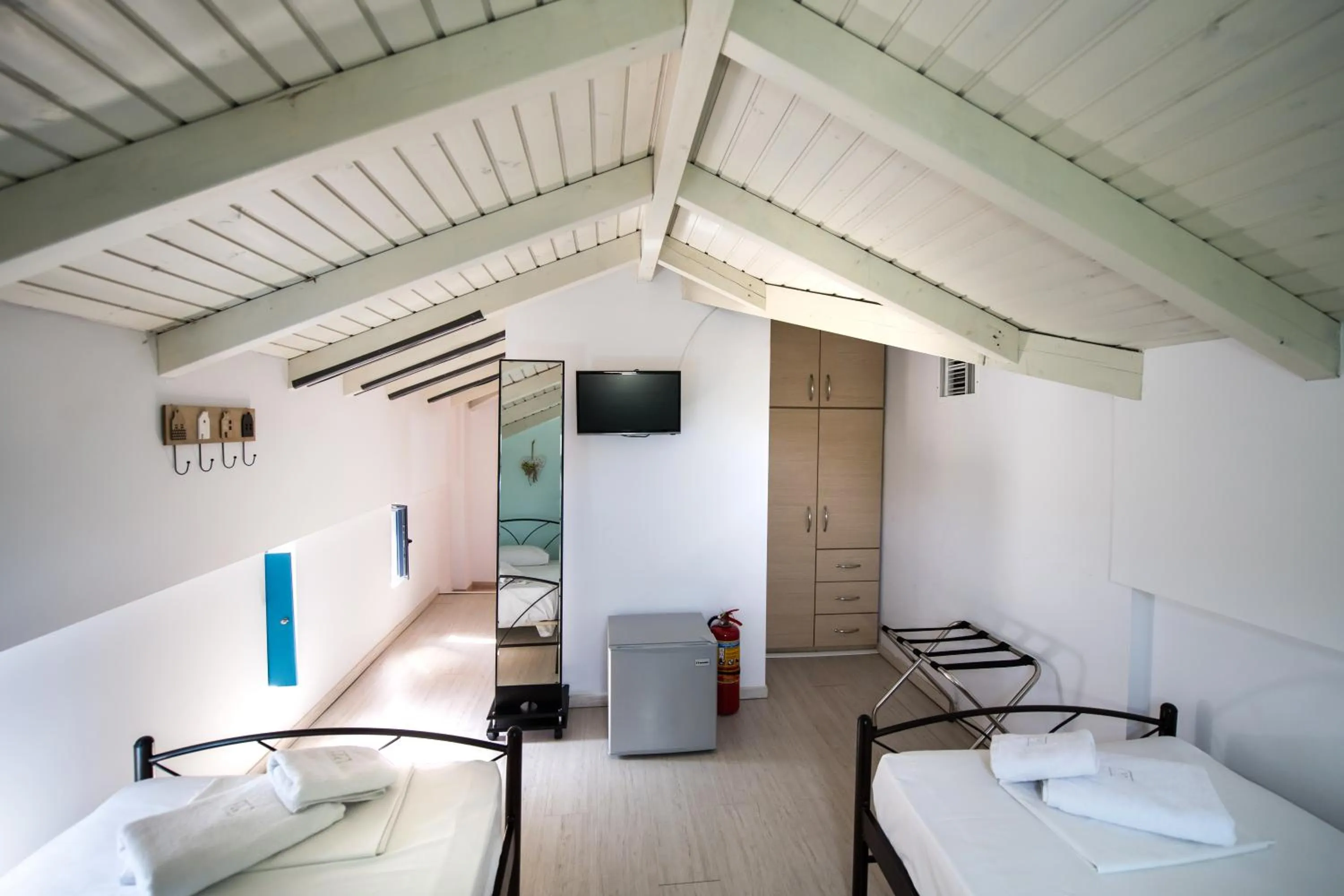 Bed in Ilianthos Apartments & Rooms