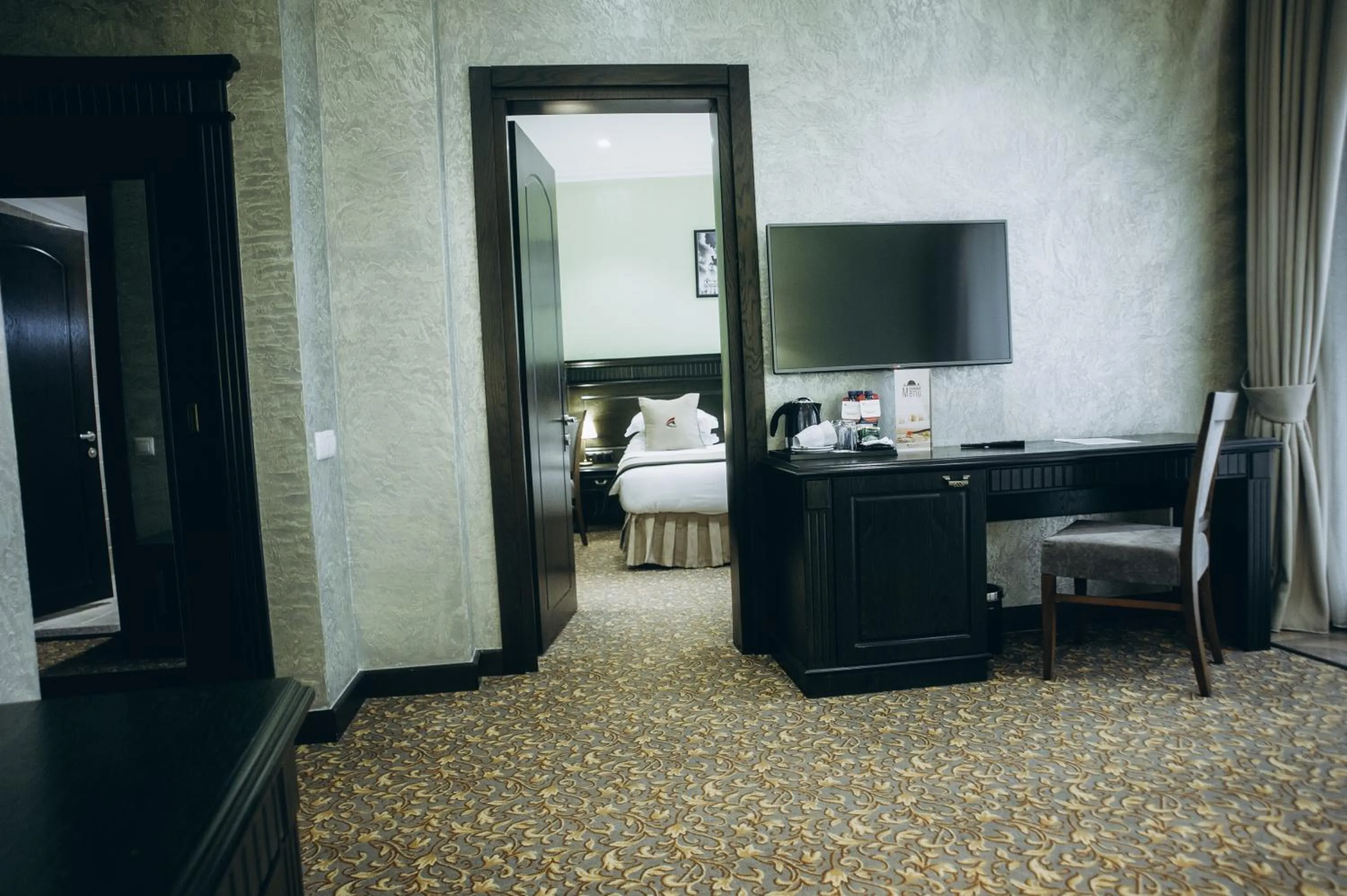 Communal lounge/ TV room, Bed in Colosseum Marina Hotel