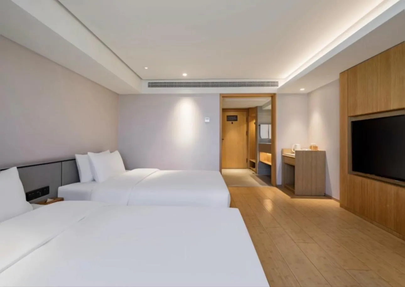 Bed in JI Hotel Shanghai Hongmei South Road Subway Station