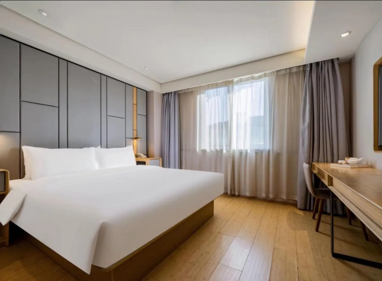 Bed in JI Hotel Shanghai Hongmei South Road Subway Station