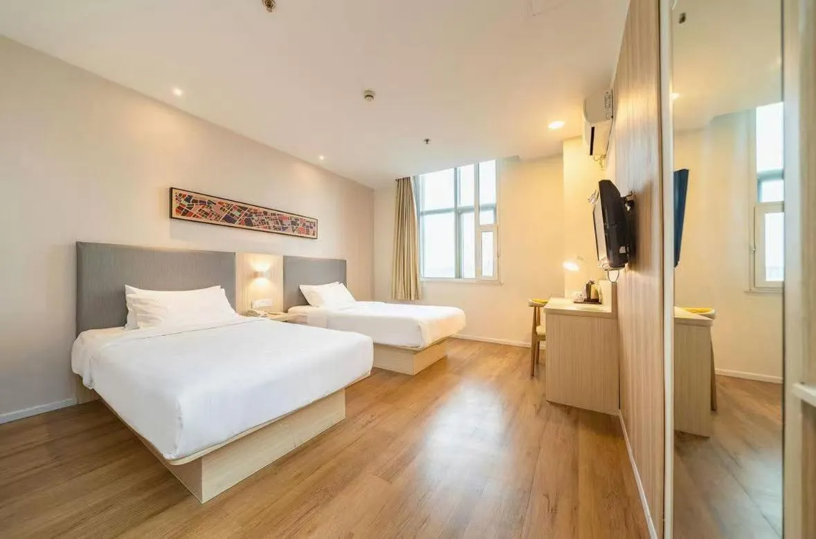 Bed in Hanting Hotel Shanghai Songjiang Sijing