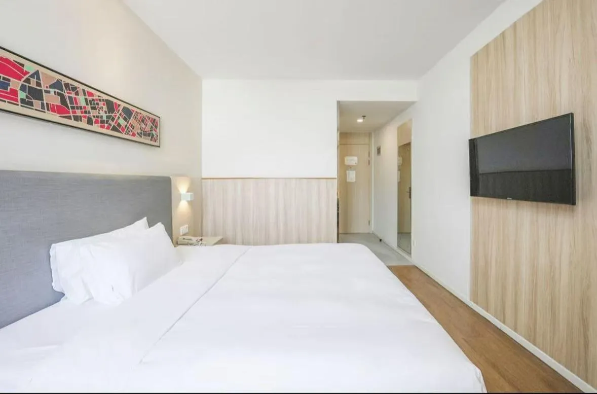 Bed in Hanting Hotel Shanghai Songjiang Sijing