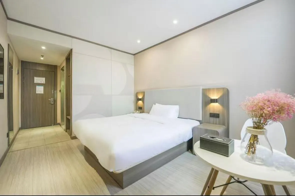 Bed in Hanting Hotel Shanghai Songjiang Sijing