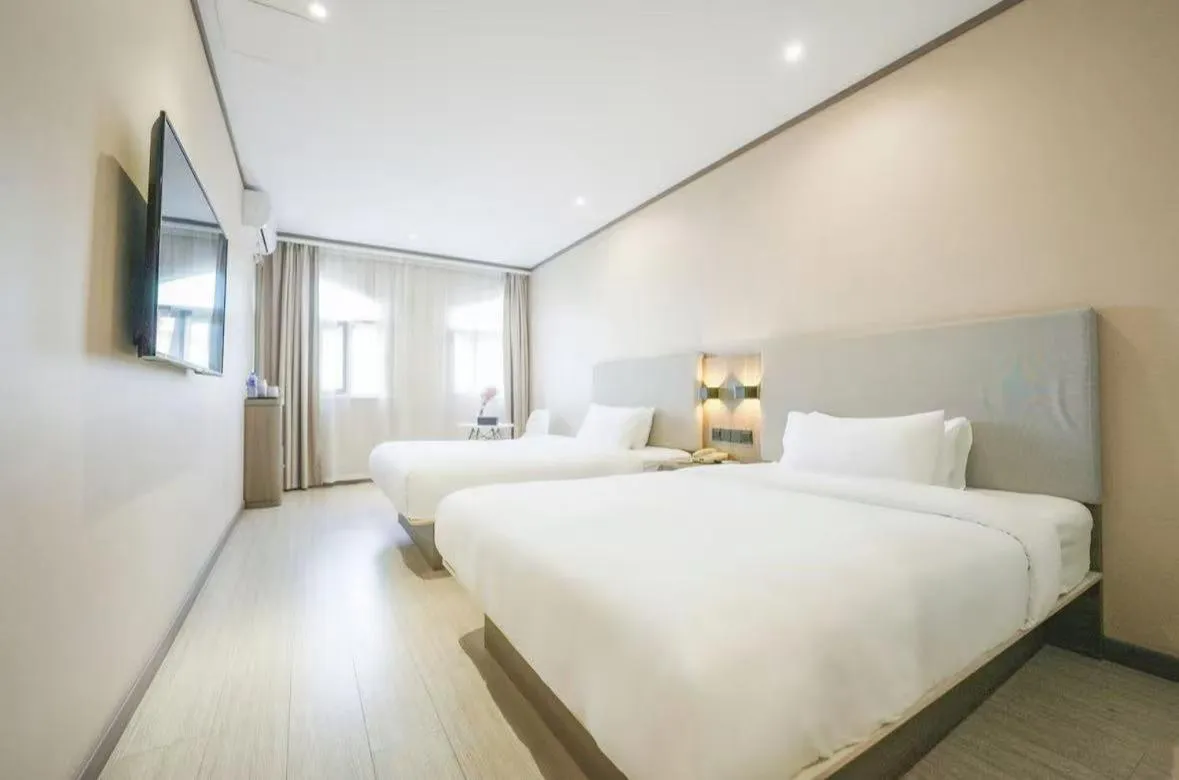 Bed in Hanting Hotel Shanghai Songjiang Sijing