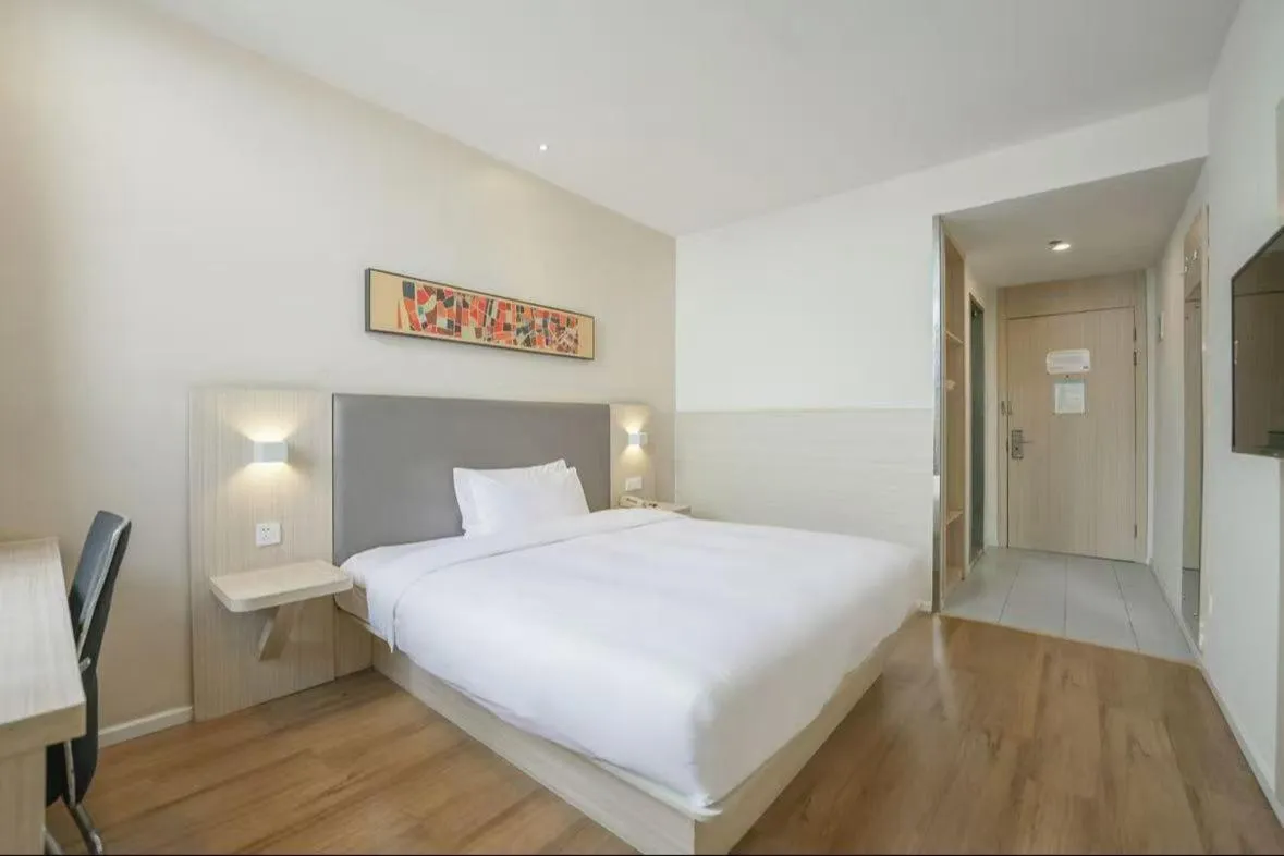 Bed in Hanting Hotel Shanghai Songjiang Sijing