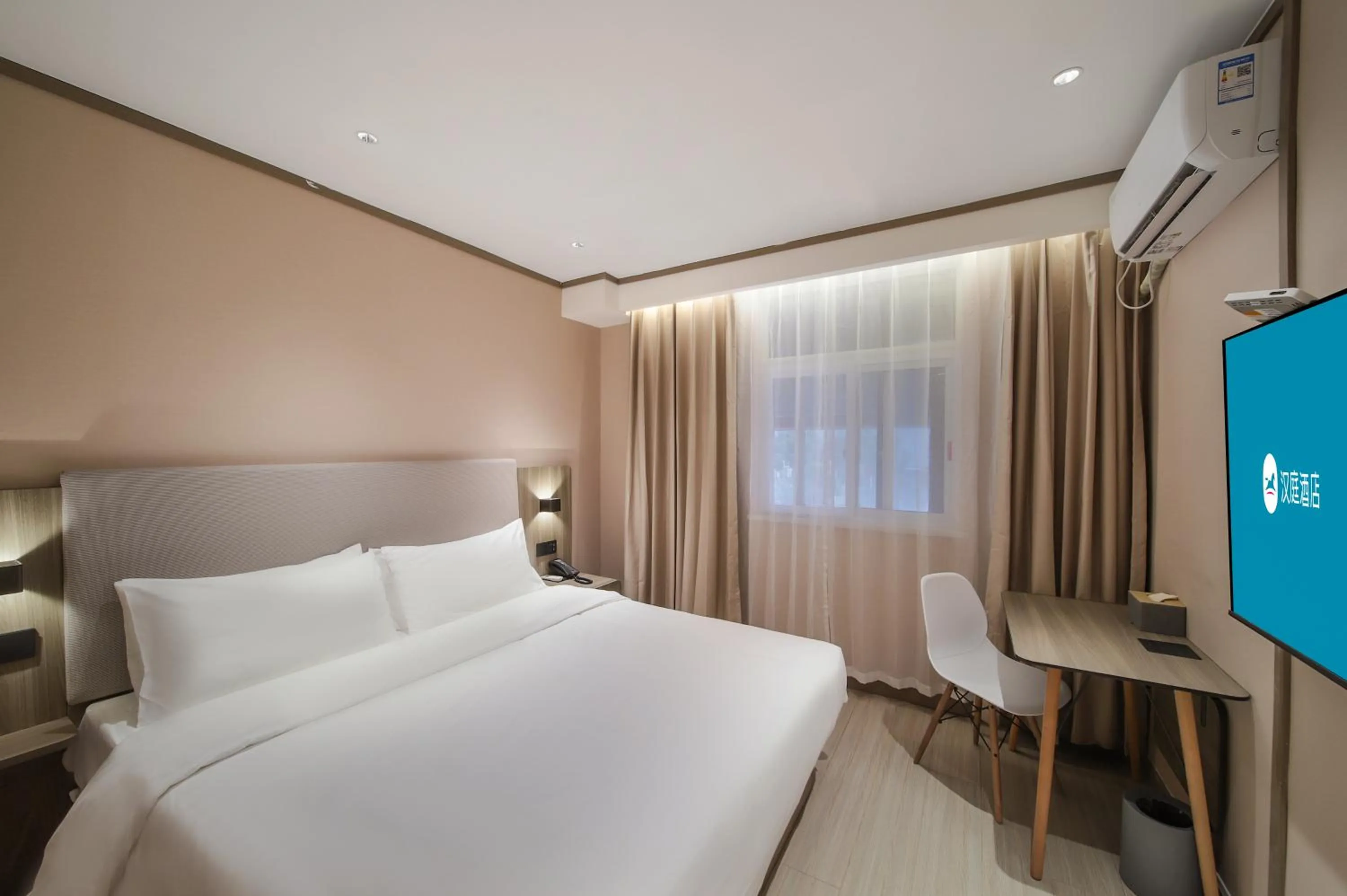 Bed in Hanting Hotel Nanjing Jiangpu Longhua Road Subway Station