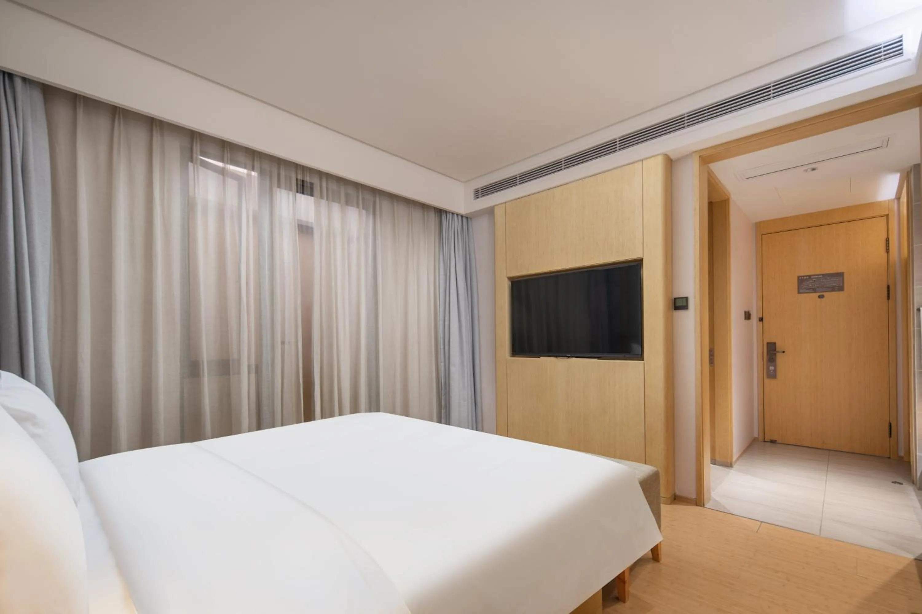 Bed in JI Hotel Chongqing Liangjiang Happiness Plaza