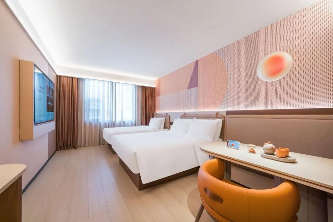 Bed in Orange Hotel Hangzhou West Lake Huanglong Sports Center