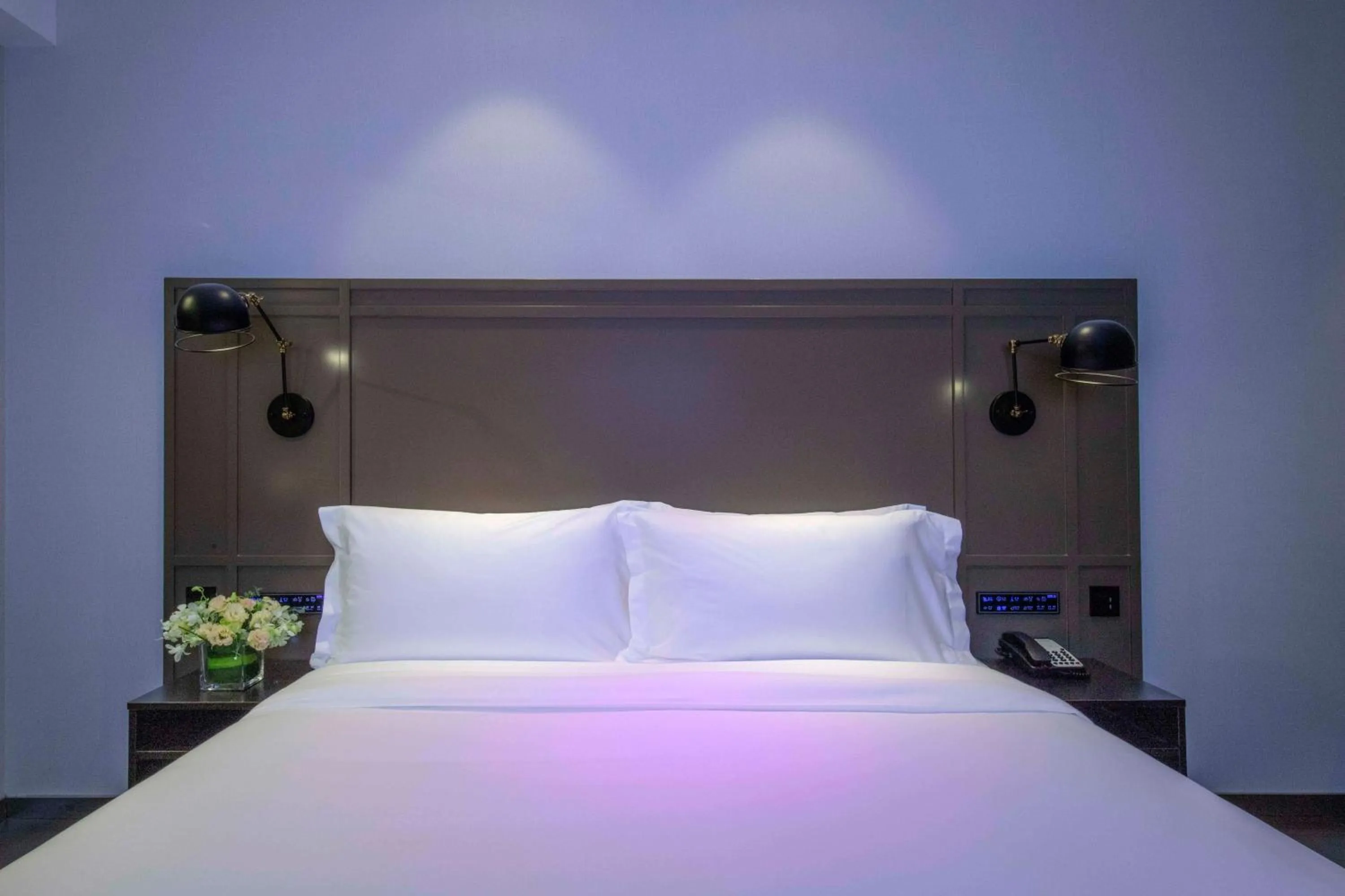 Bed in Orange Hotel Shanghai Hongqiao Railway Station Qixin Road (formerly Hongqiao National Exhibition and Convention Center Qixin Road Branch)