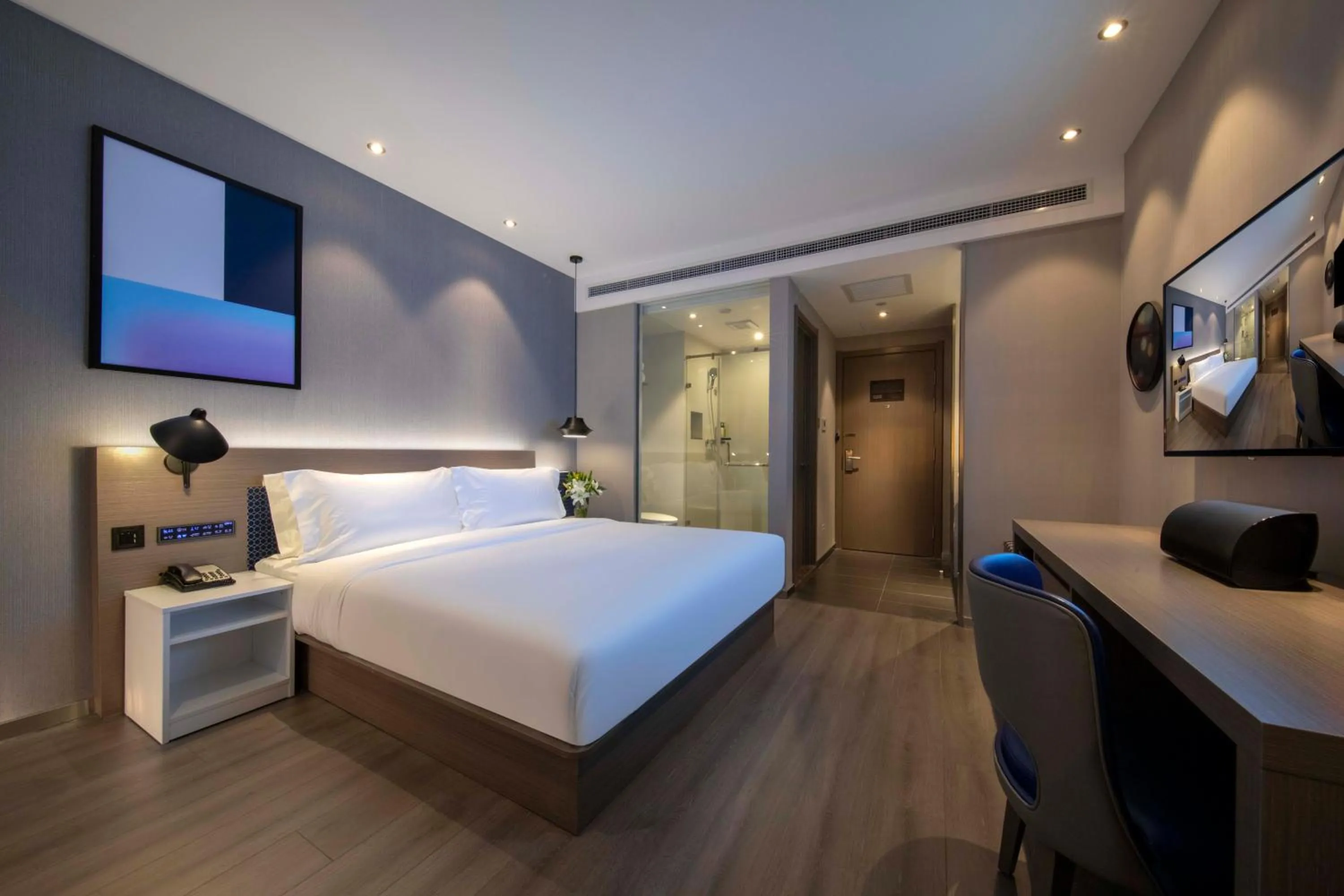 Bed in Orange Hotel Shanghai Hongqiao Railway Station Qixin Road (formerly Hongqiao National Exhibition and Convention Center Qixin Road Branch)