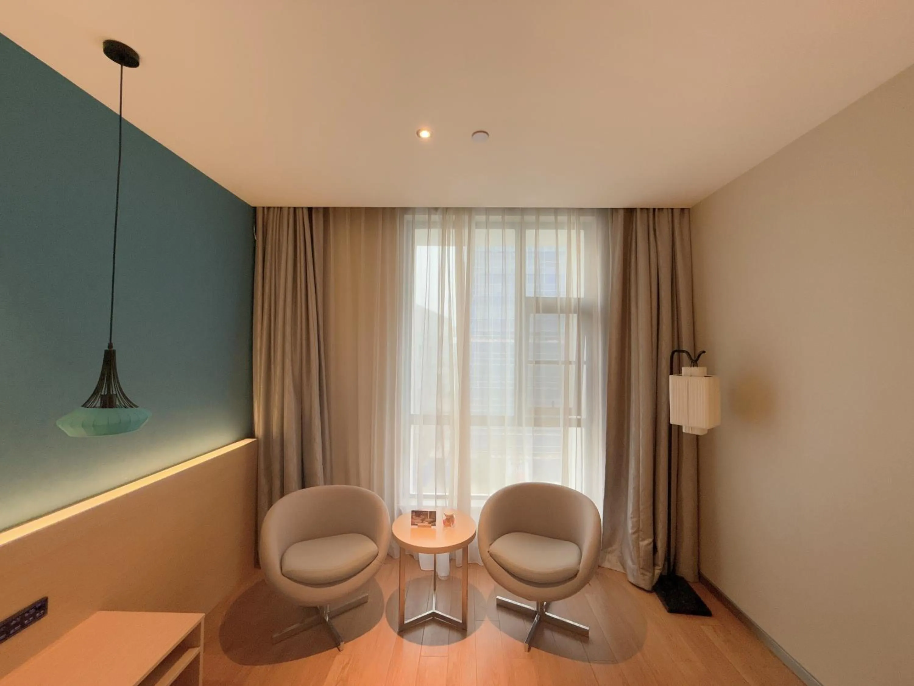 Seating area in Orange Hotel Suzhou North Station Cailian Square