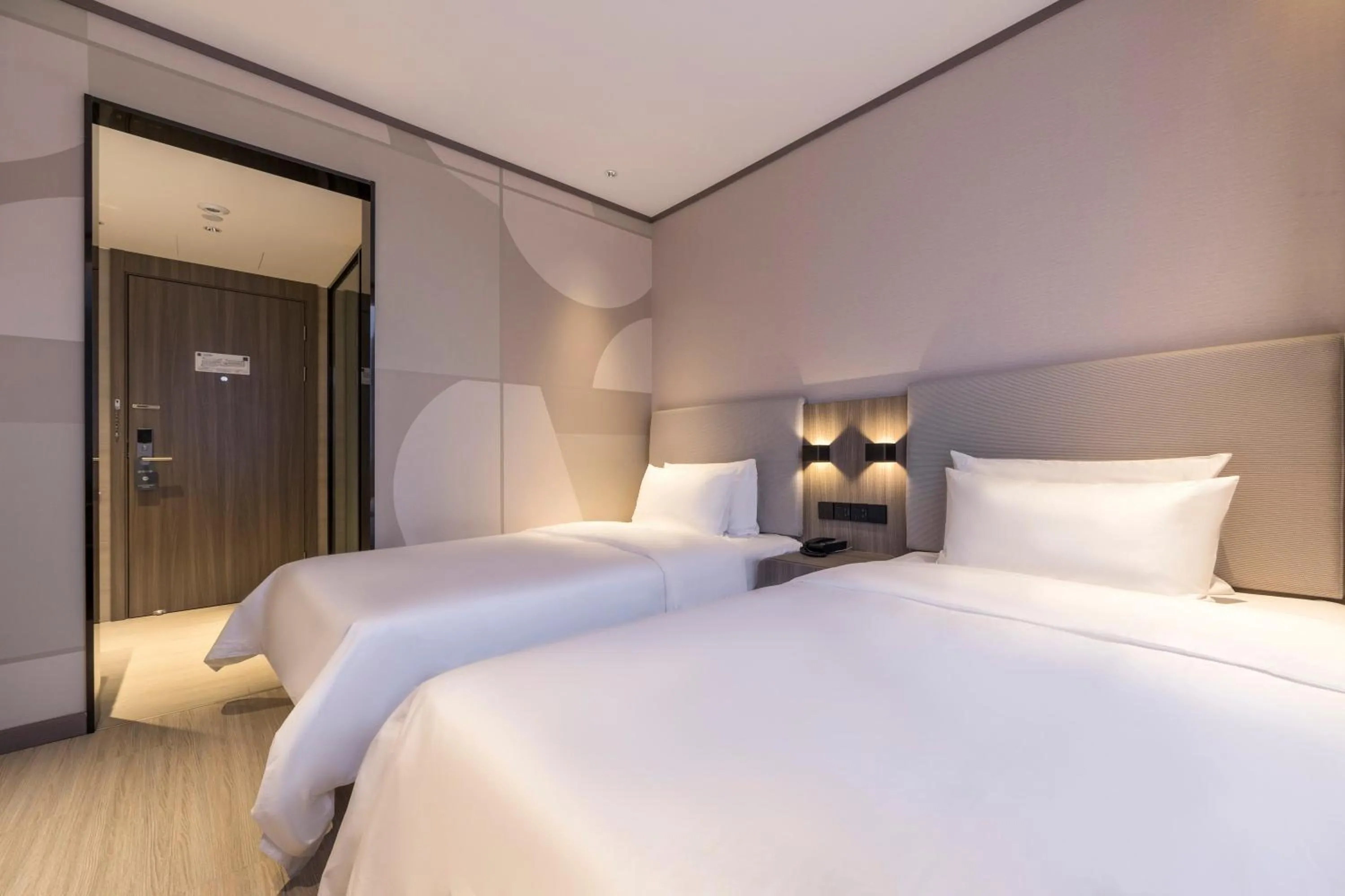 Bed in Hanting Hotel Shanghai South Station East China University of Science and Technology