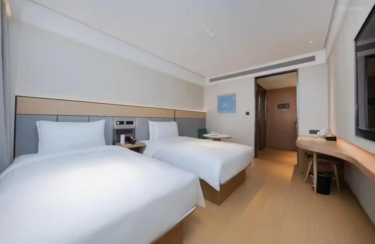 Bed in JI Hotel Beijing Yansha Sanyuan Bridge