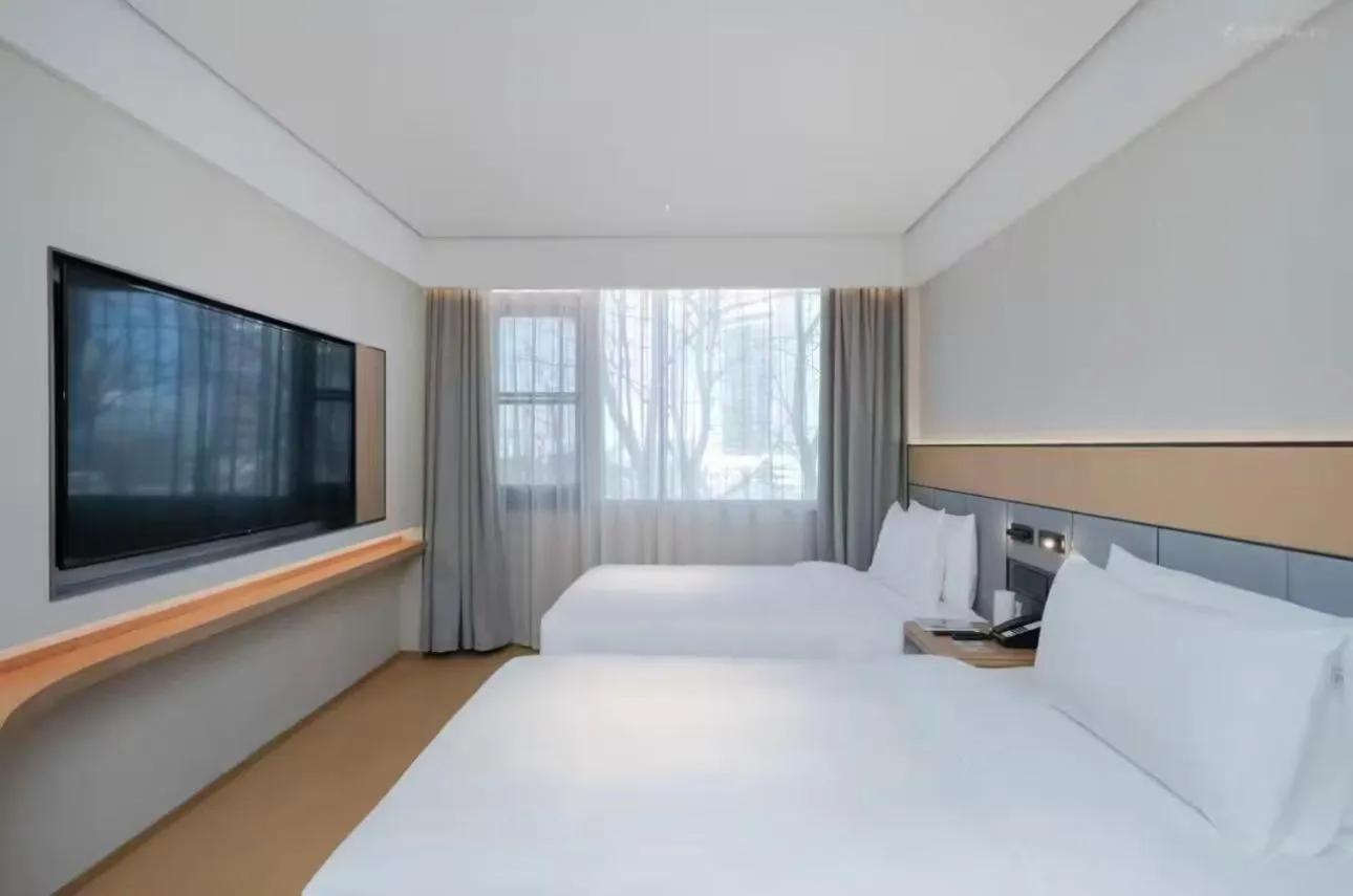 Bed in JI Hotel Beijing Yansha Sanyuan Bridge