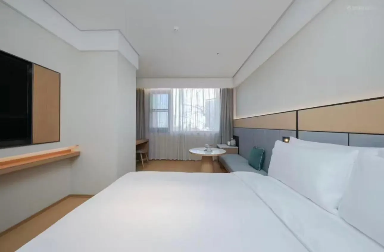 Bed in JI Hotel Beijing Yansha Sanyuan Bridge
