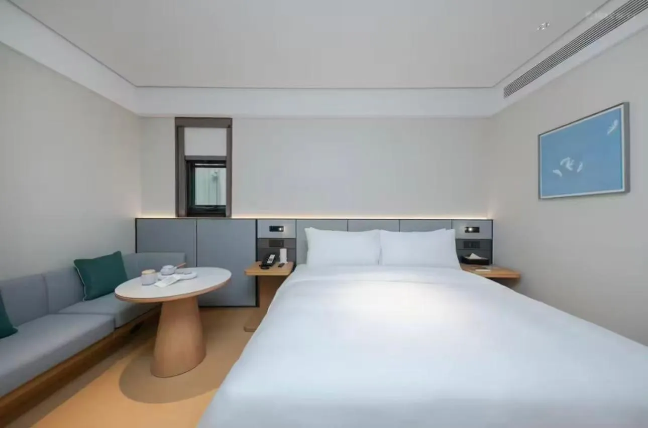 Bed in JI Hotel Beijing Yansha Sanyuan Bridge