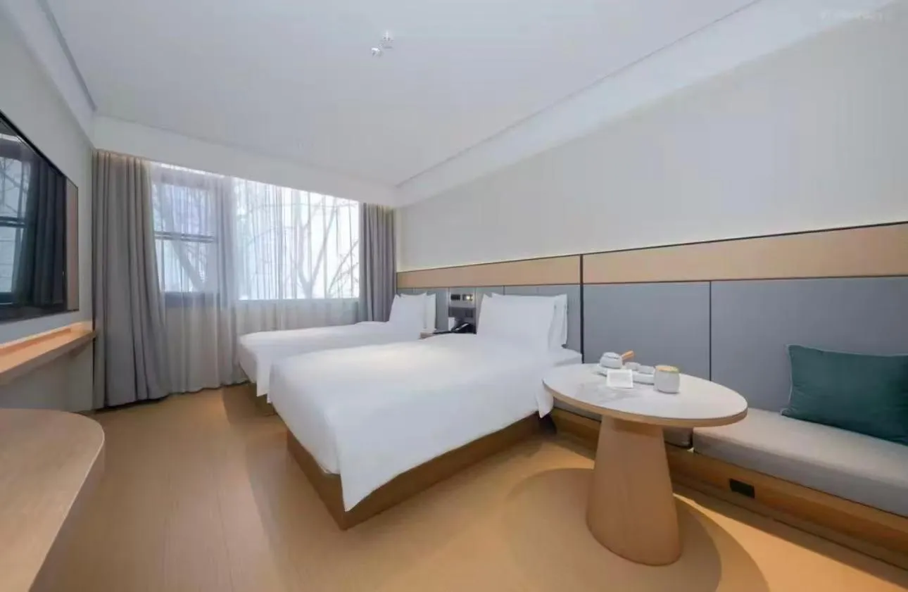 Bed in JI Hotel Beijing Yansha Sanyuan Bridge