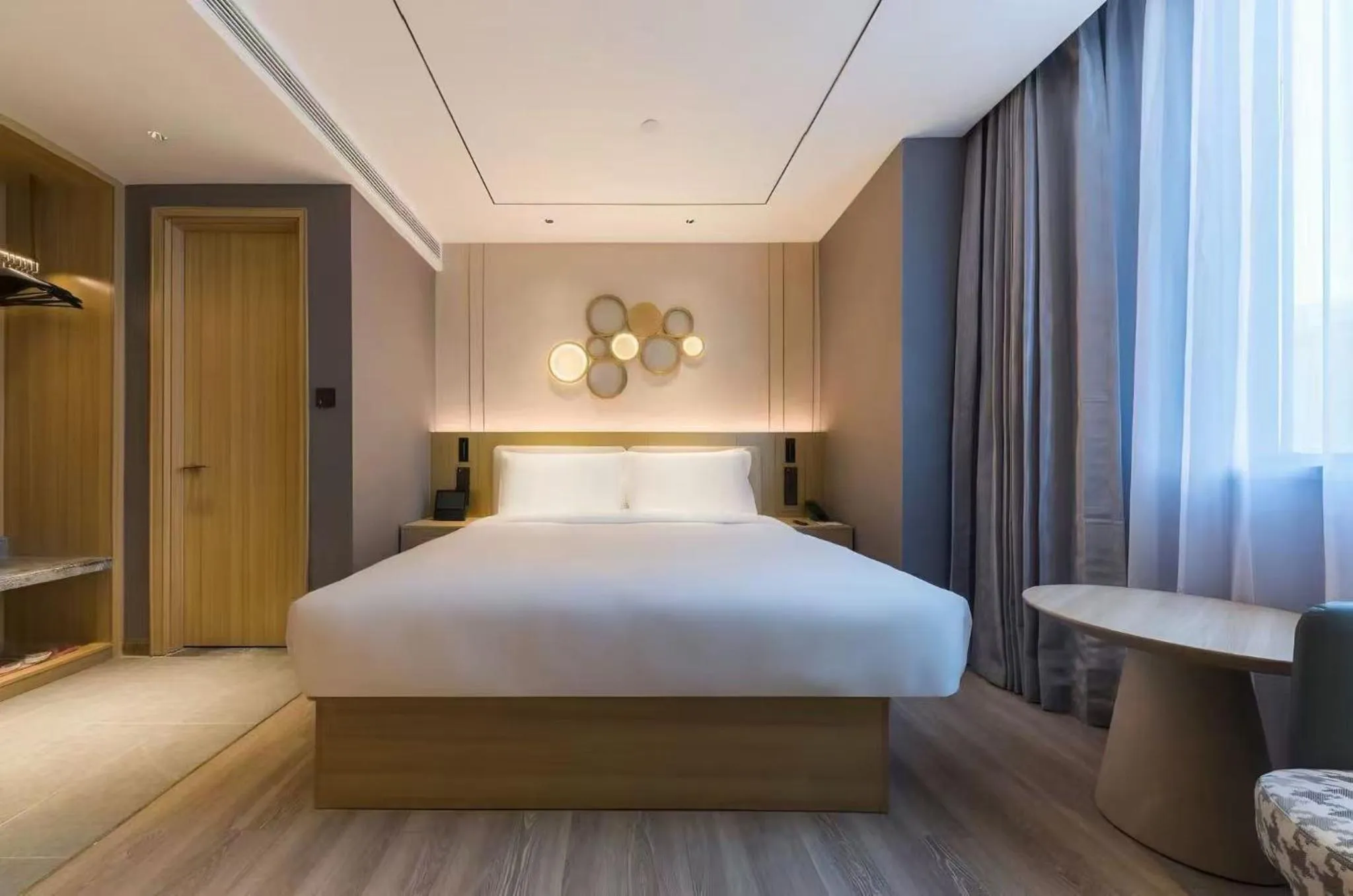 Bed in Orange Hotel Shanghai World Expo Center