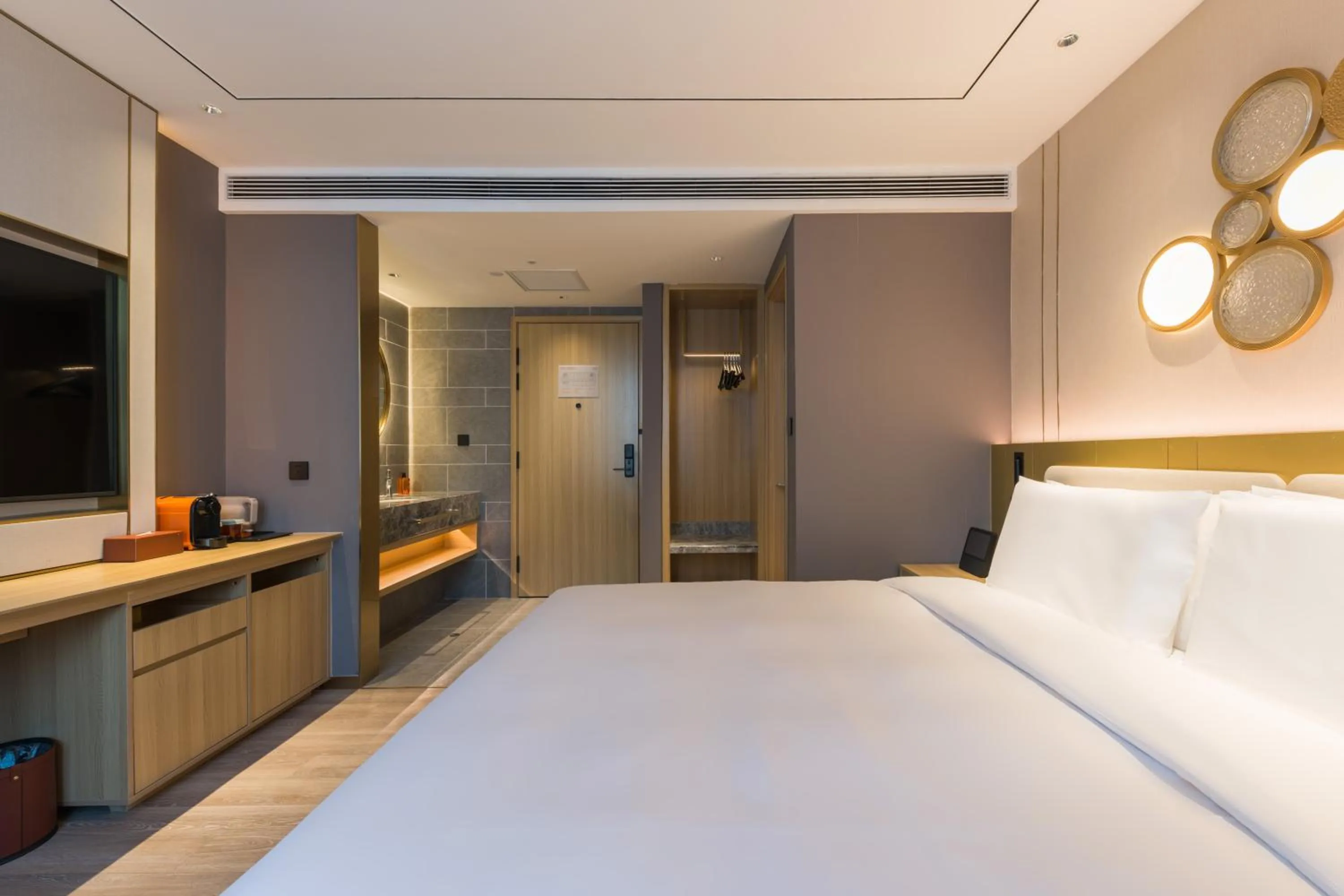 Bed in Orange Hotel Shanghai World Expo Center