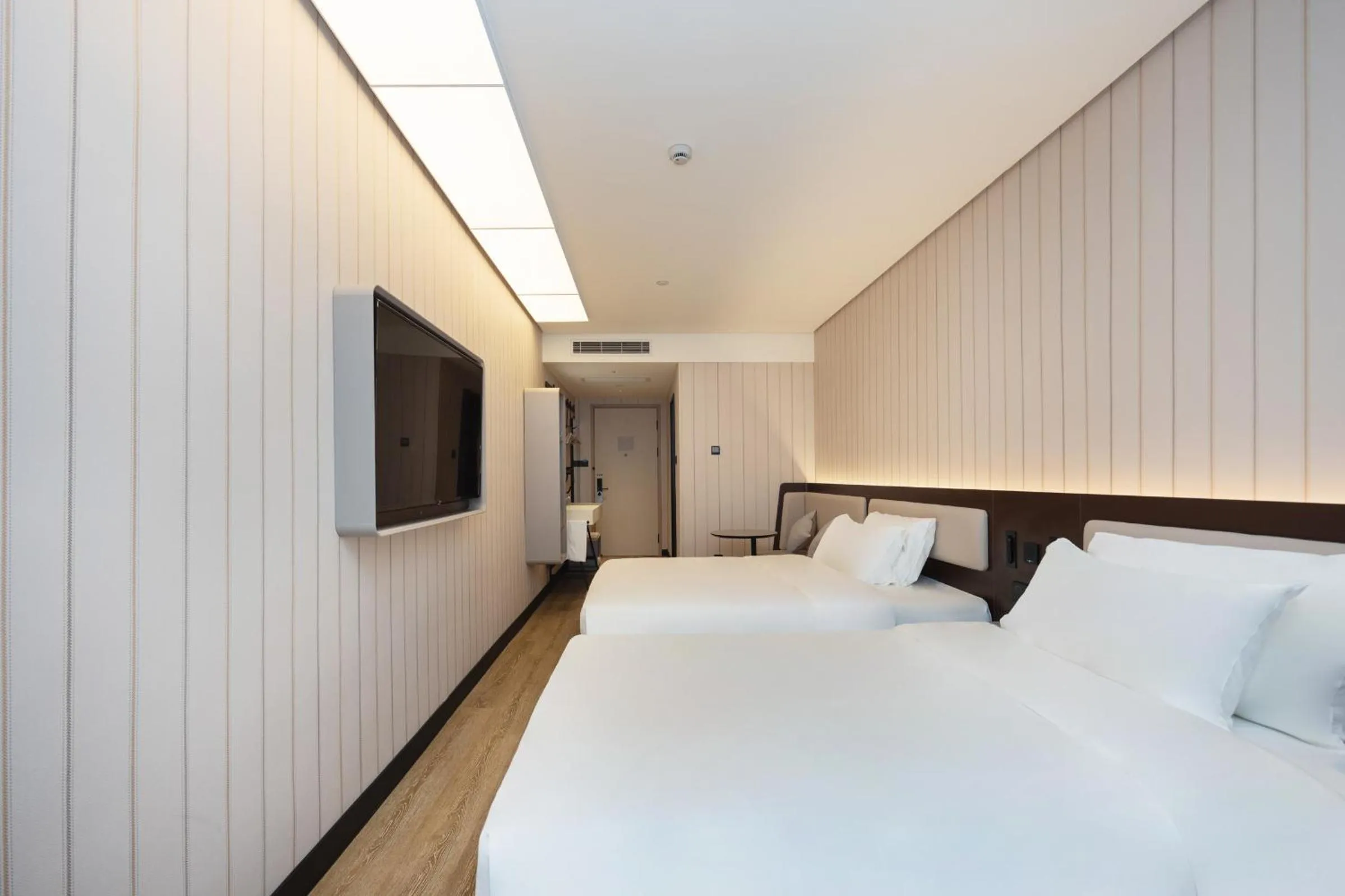 Bed in Hanting Hotel Shanghai Yishan Road Center