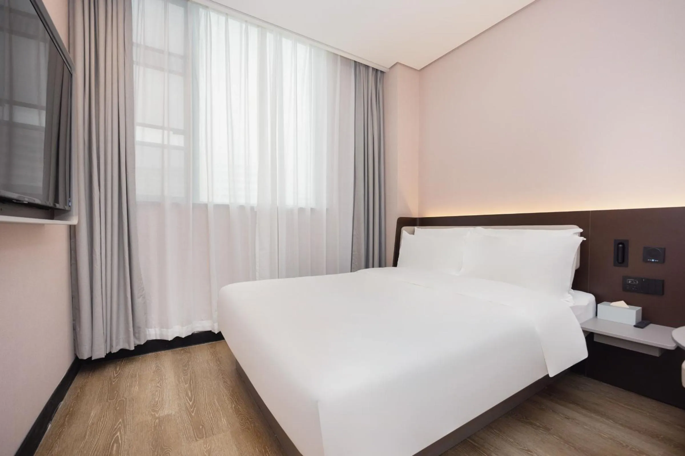 Bed in Hanting Hotel Shanghai Yishan Road Center