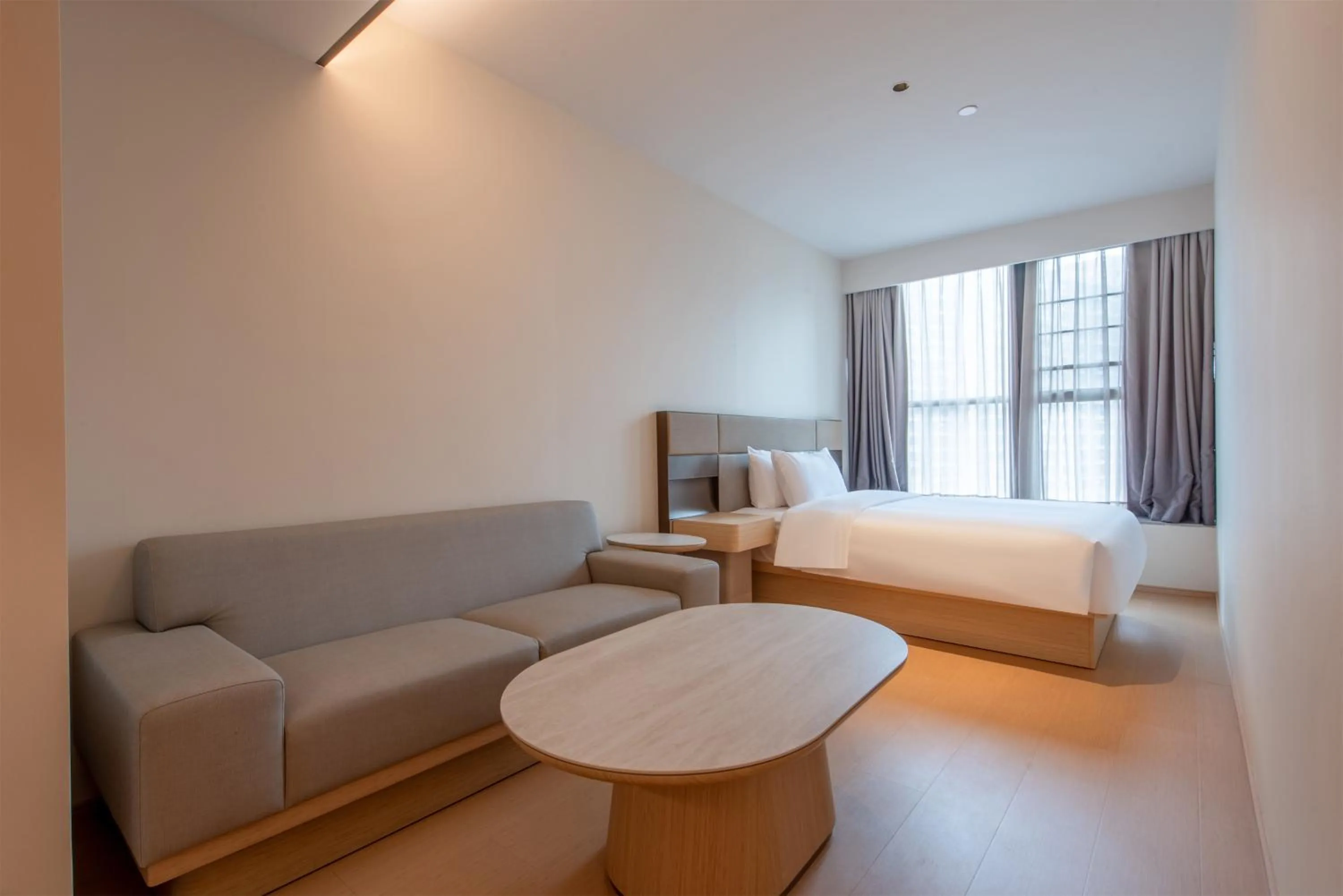 Living room, Bed in JI Hotel Guangzhou Huangpu Dasha East Subway Station