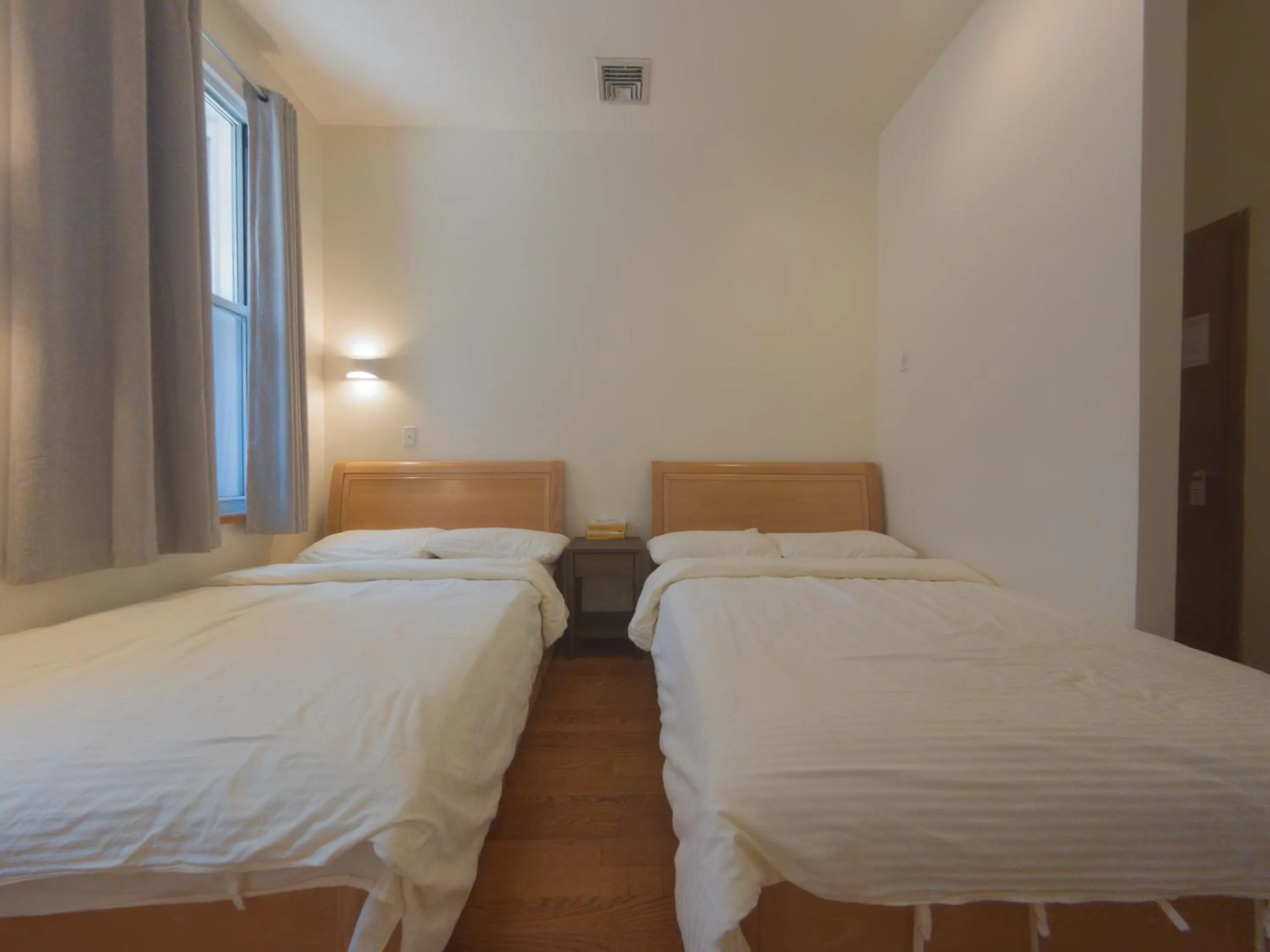 Bed in U.S. Pacific Hotel