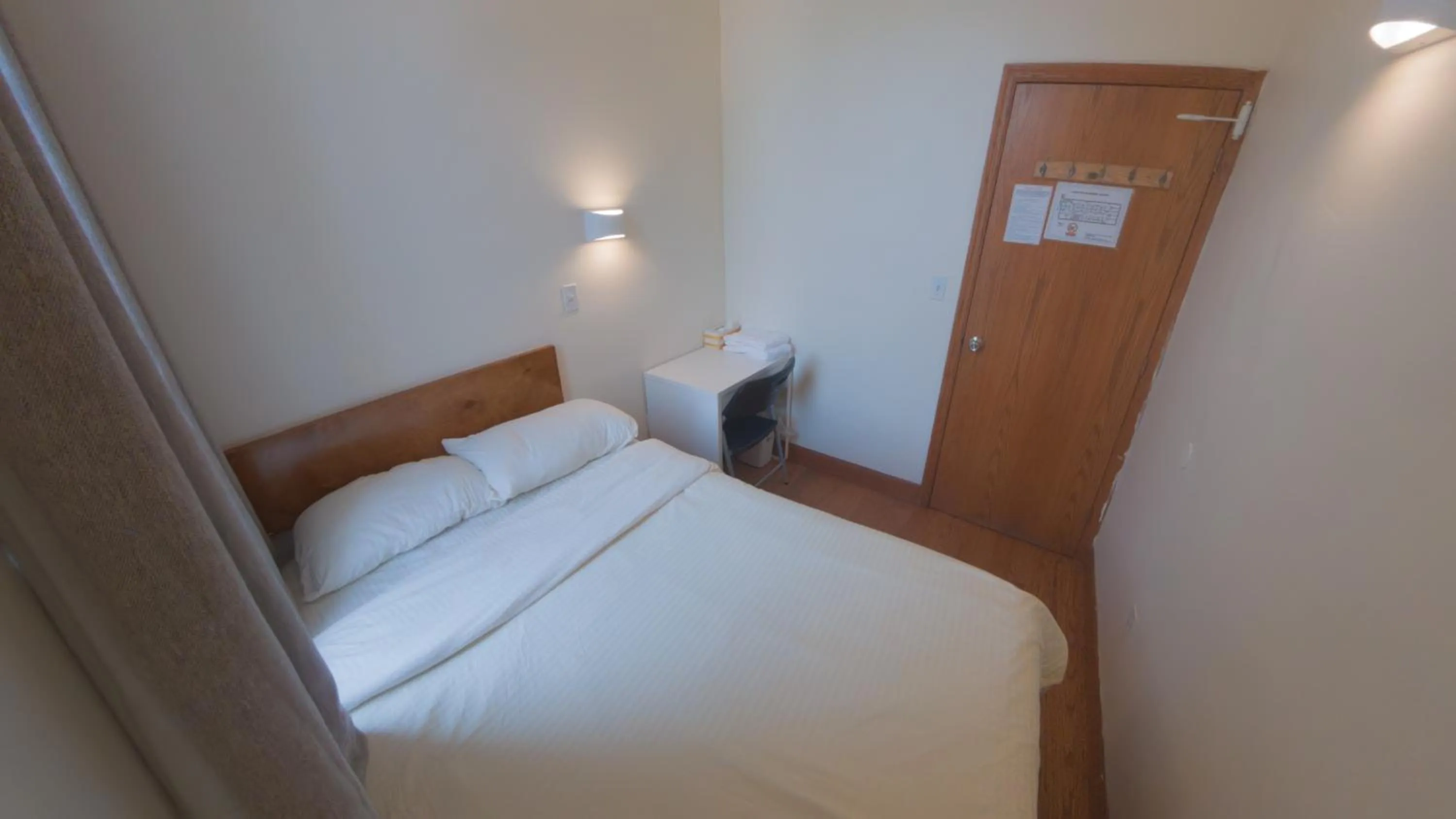 Bed in U.S. Pacific Hotel