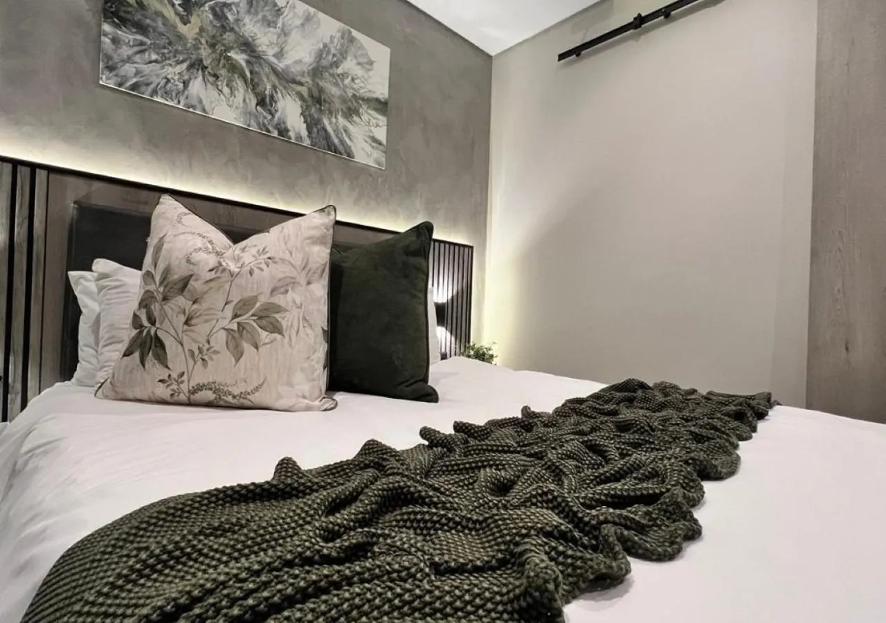 Bed in The Cycad Lodge & Chalets