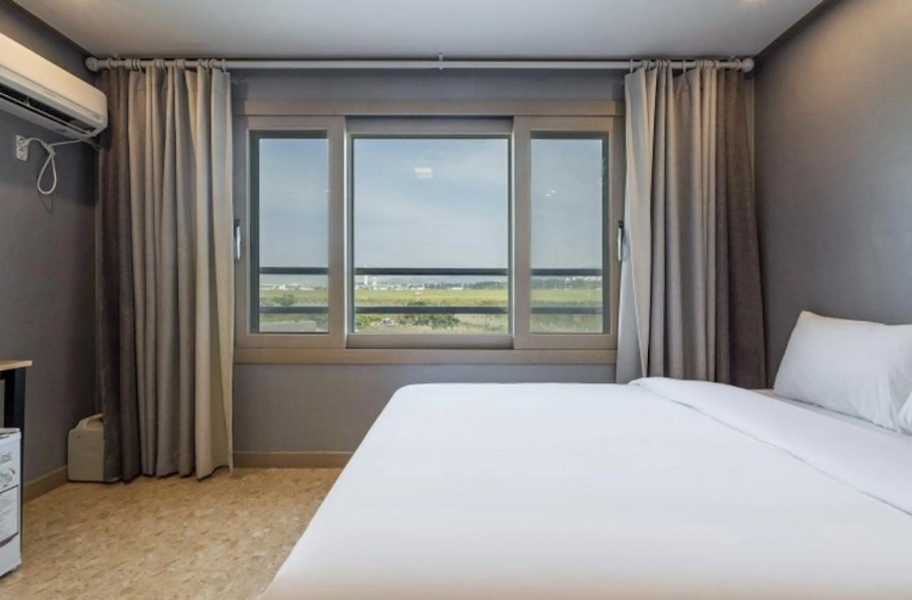 Bed in Jeju Pure Stay Ocean