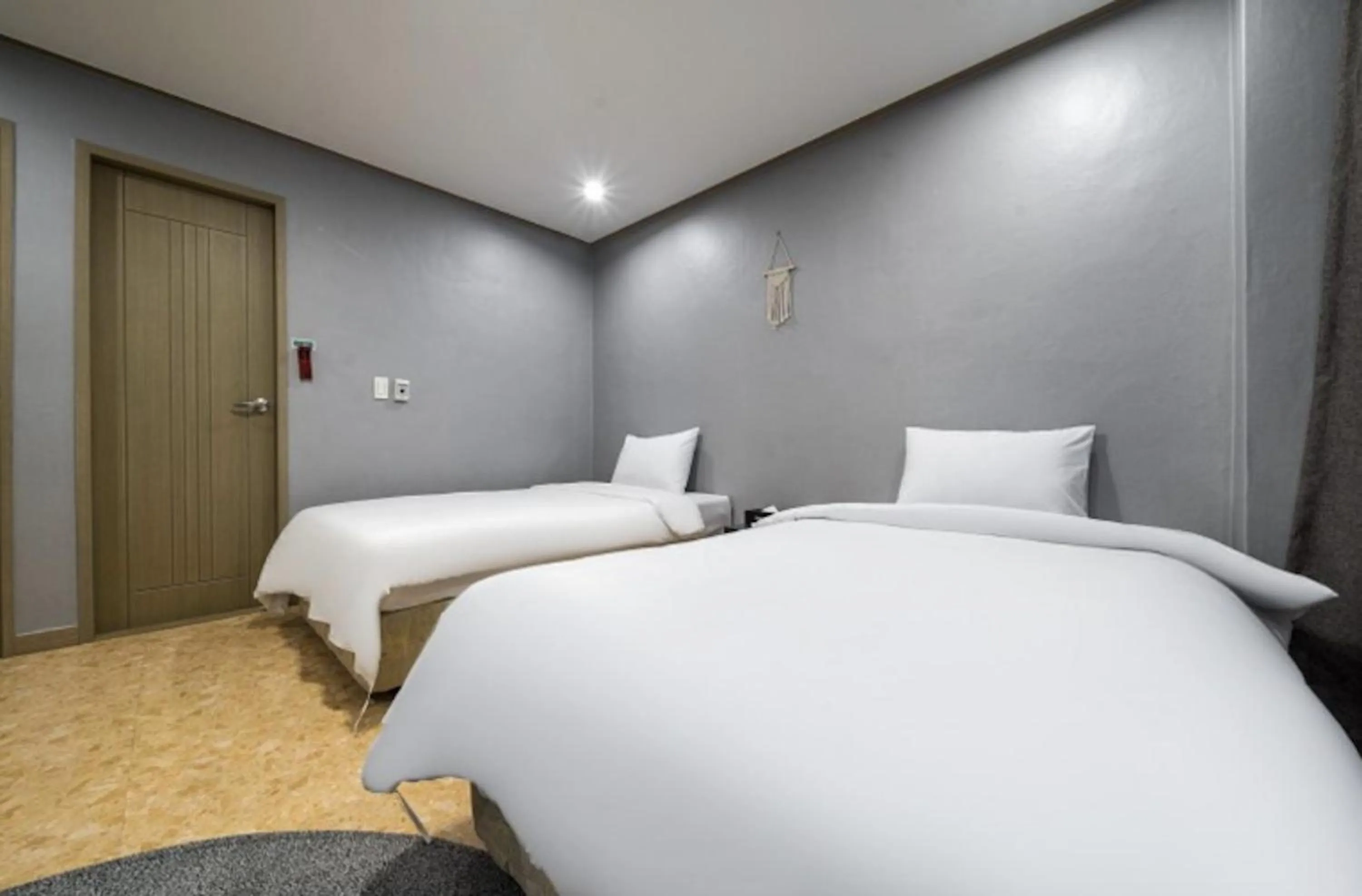 Bed in Jeju Pure Stay Ocean