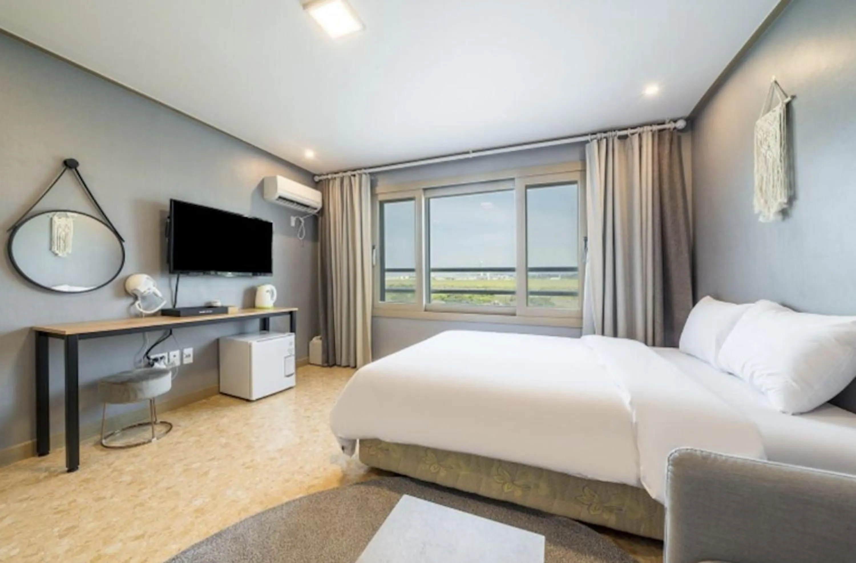 Bed in Jeju Pure Stay Ocean