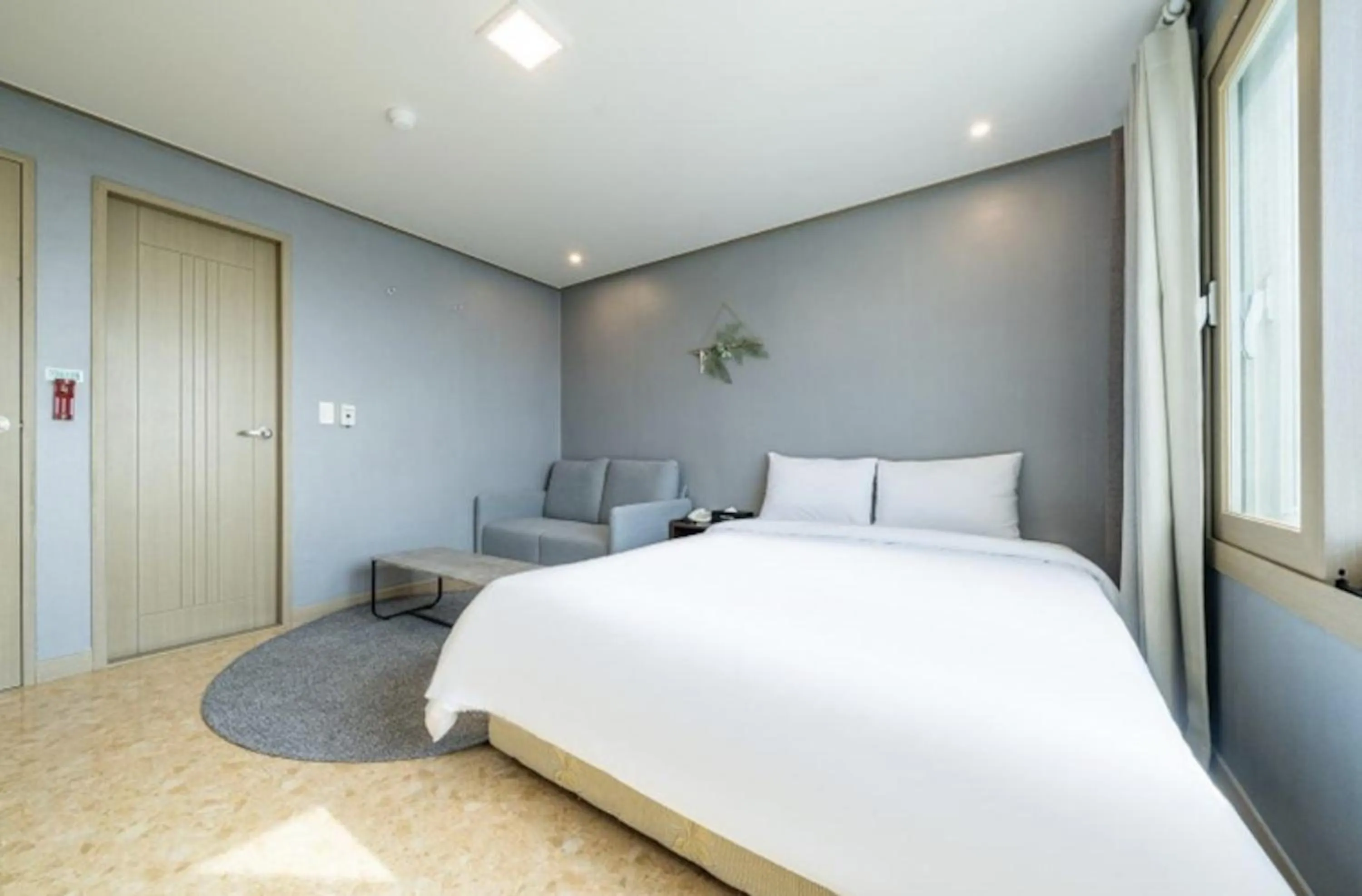 Bed in Jeju Pure Stay Ocean