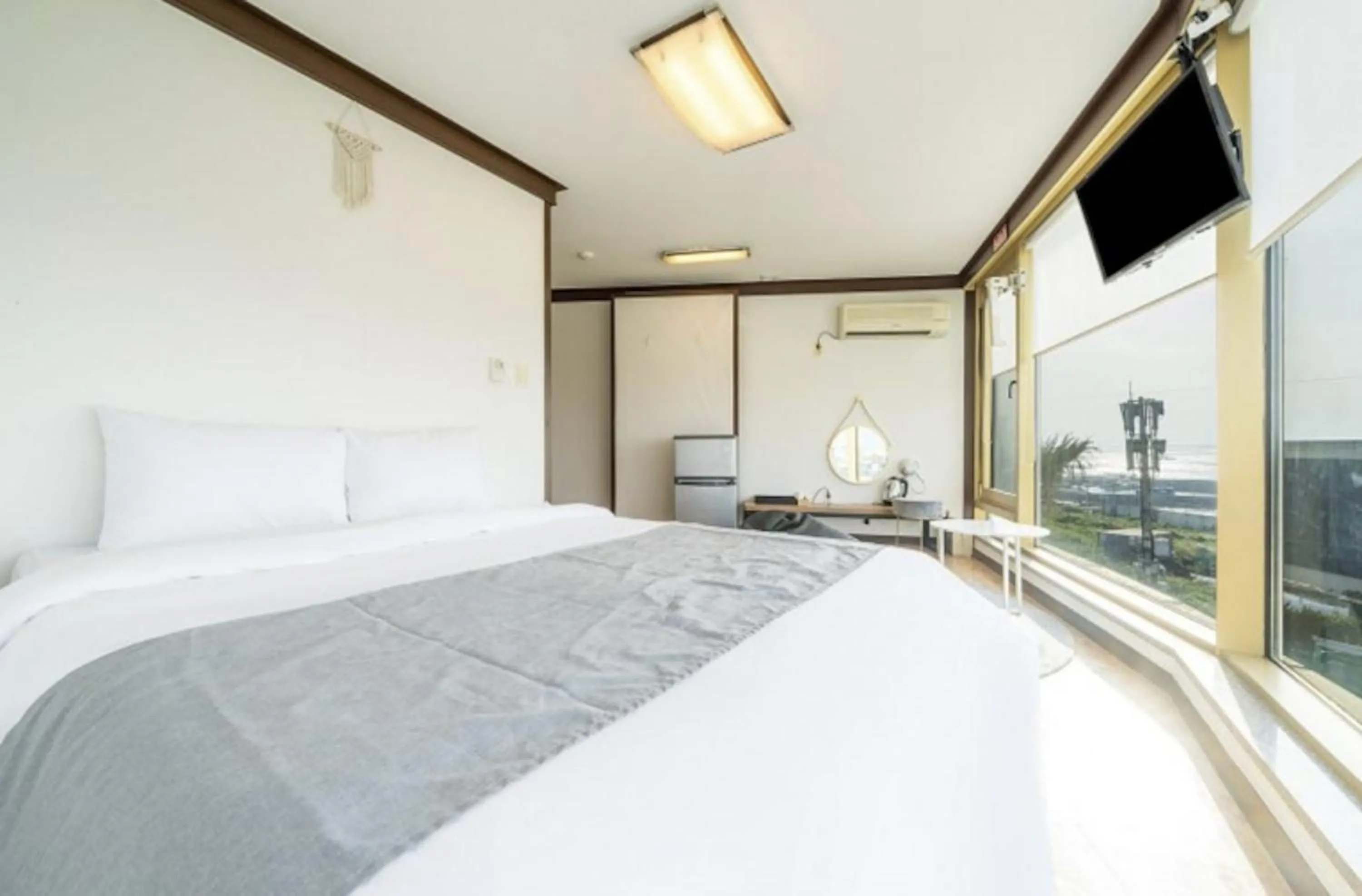 Bed in Jeju Pure Stay Ocean