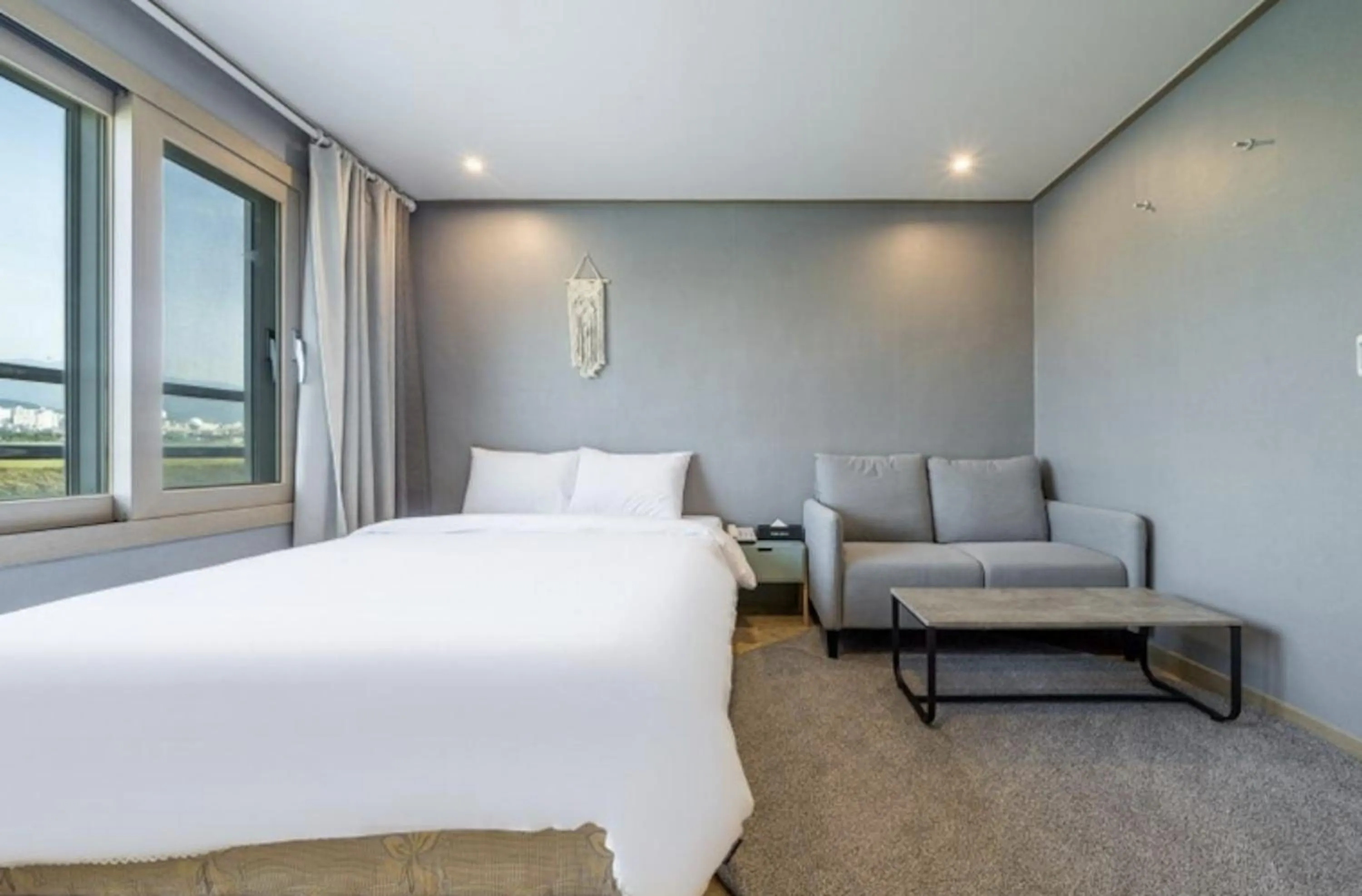 Bed in Jeju Pure Stay Ocean