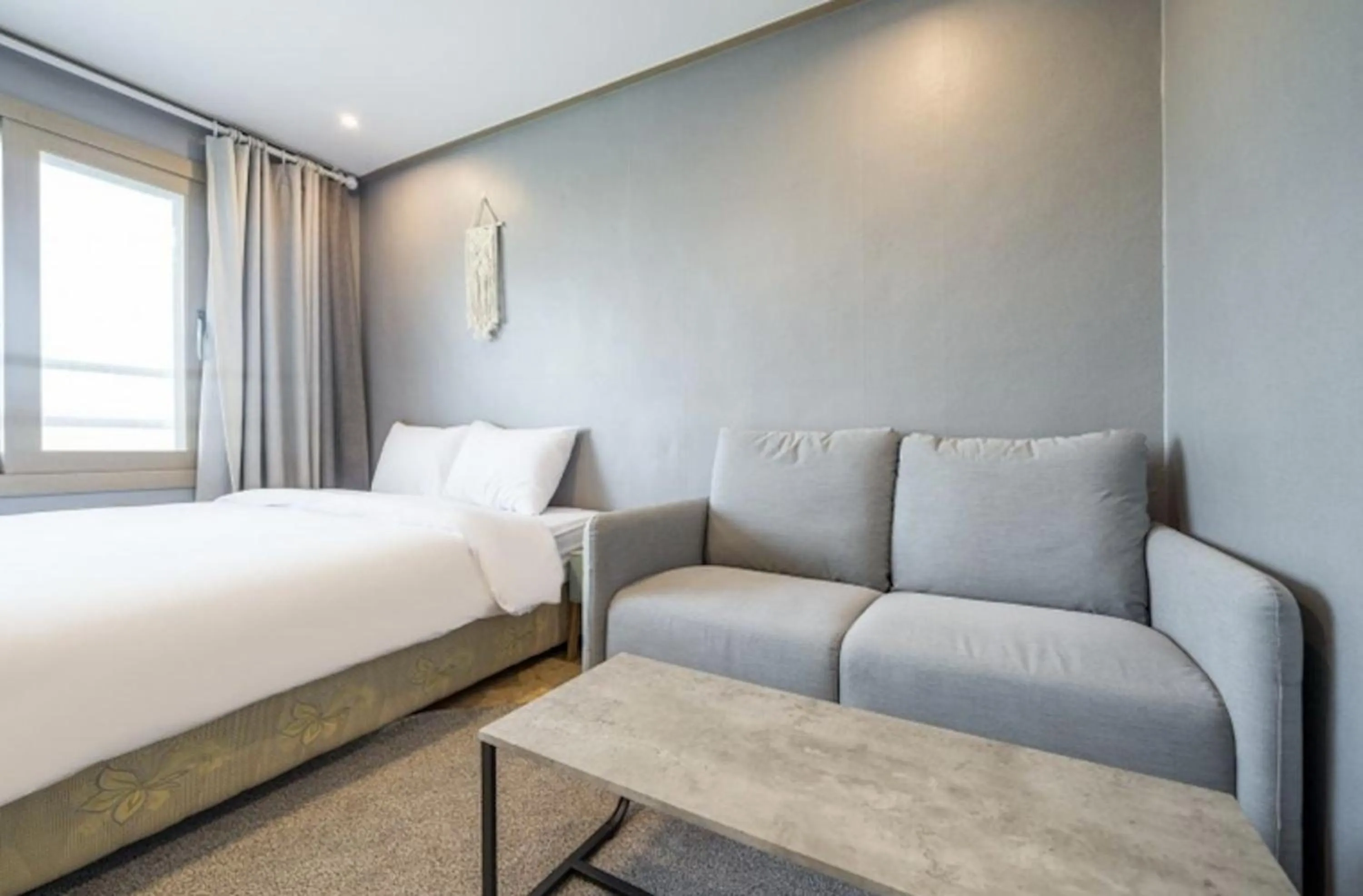 Bed in Jeju Pure Stay Ocean