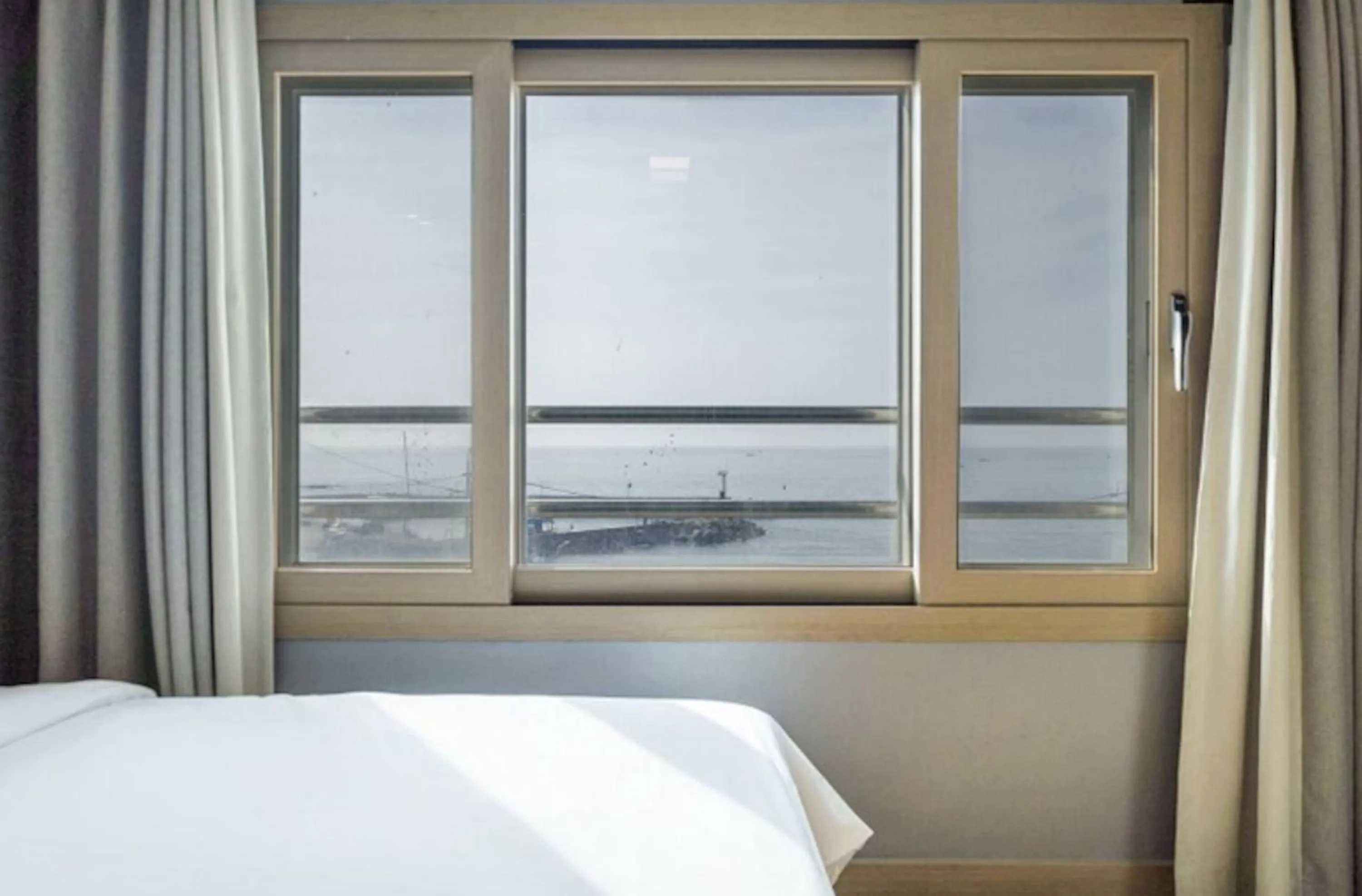 Bed in Jeju Pure Stay Ocean