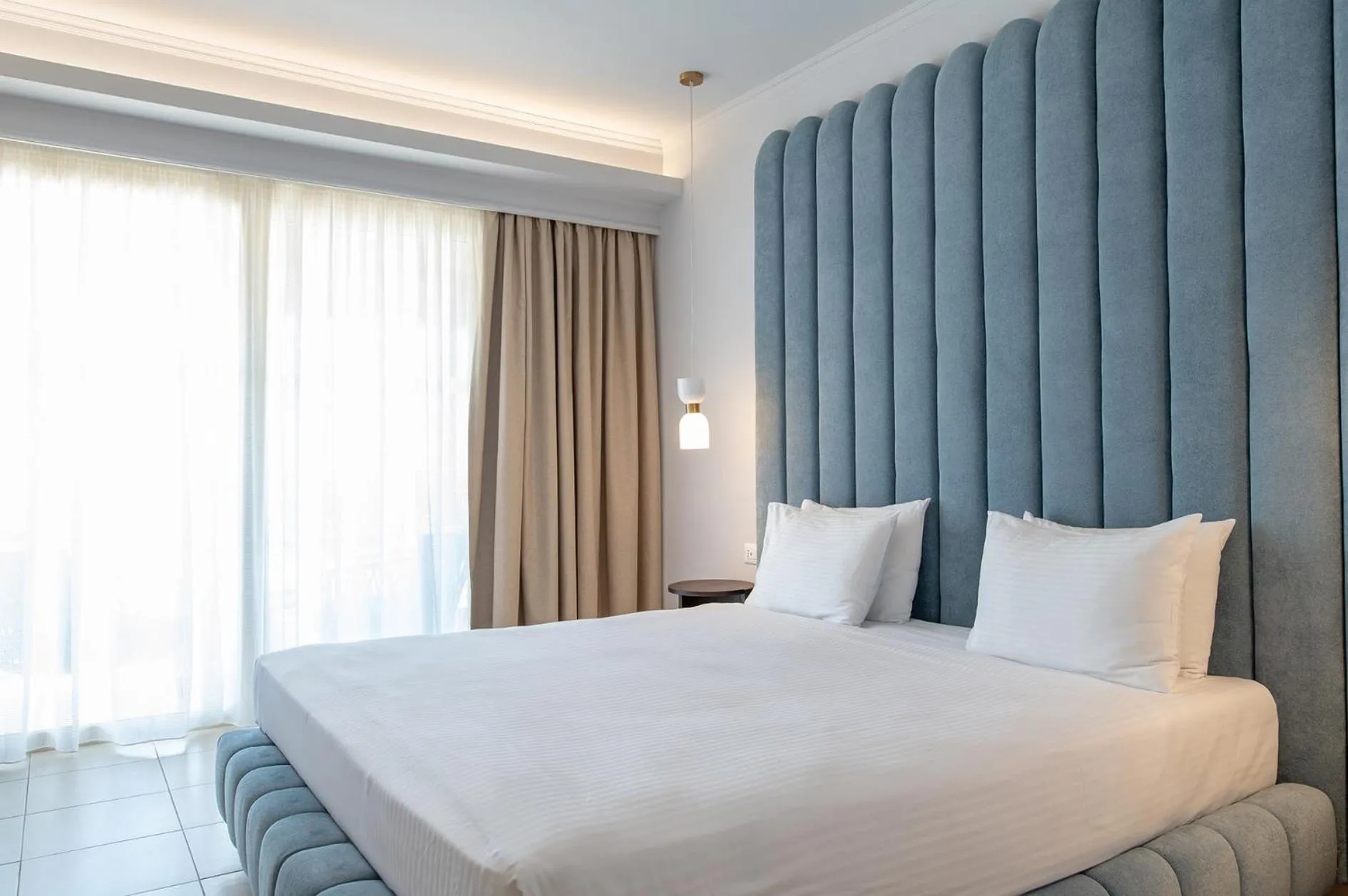 Bed in Grand Blue Beach Hotel