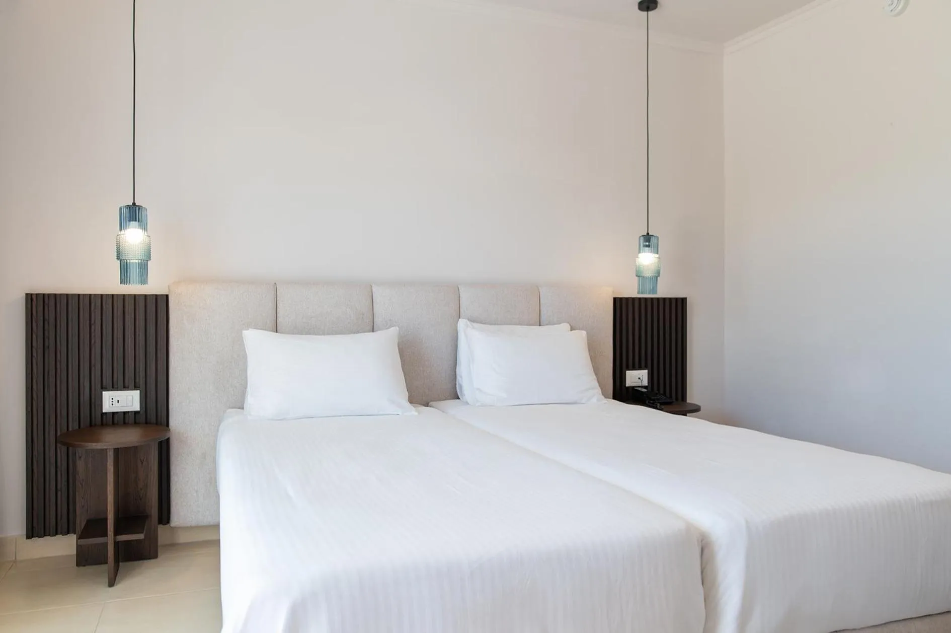 Bed in Grand Blue Beach Hotel