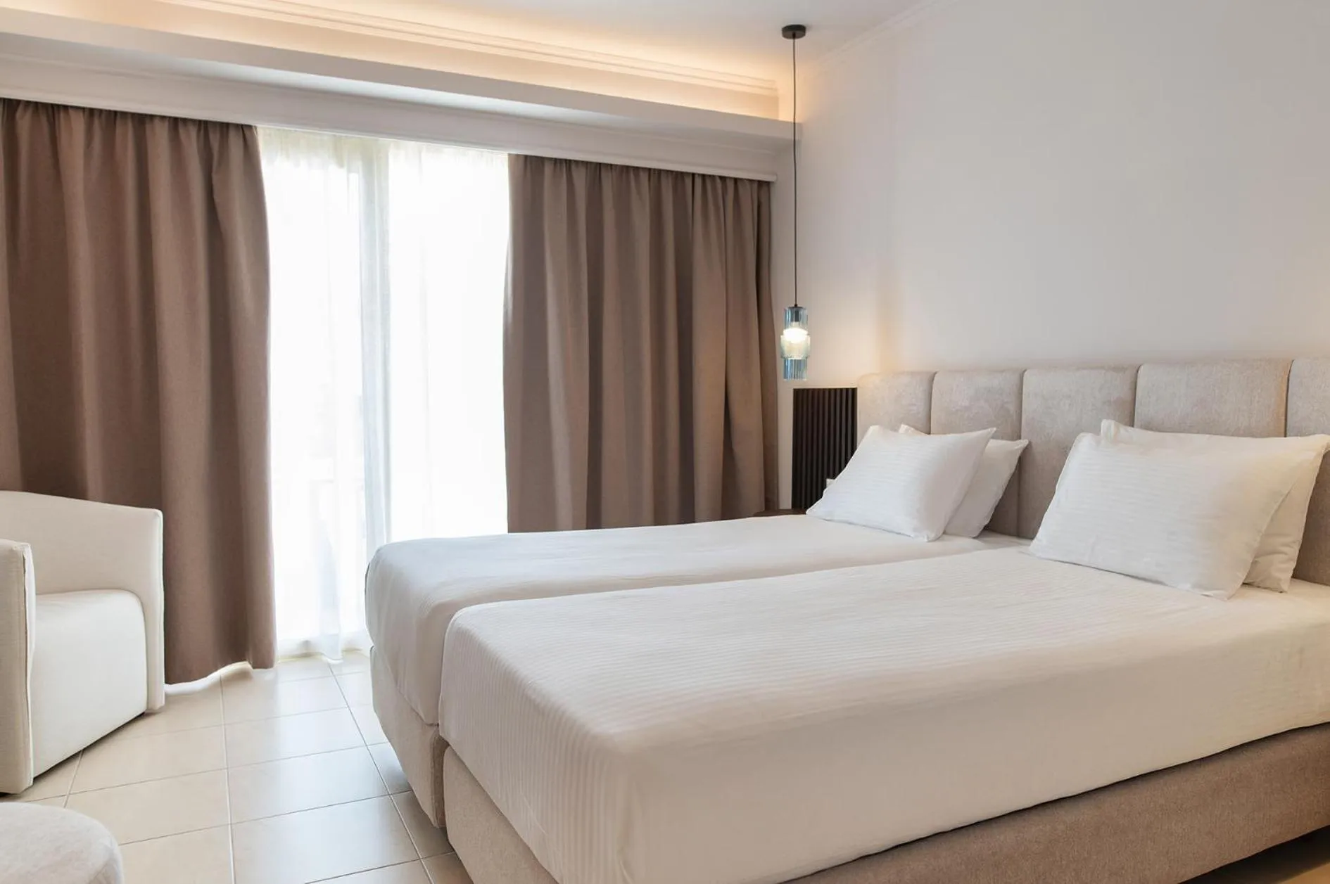 Bed in Grand Blue Beach Hotel