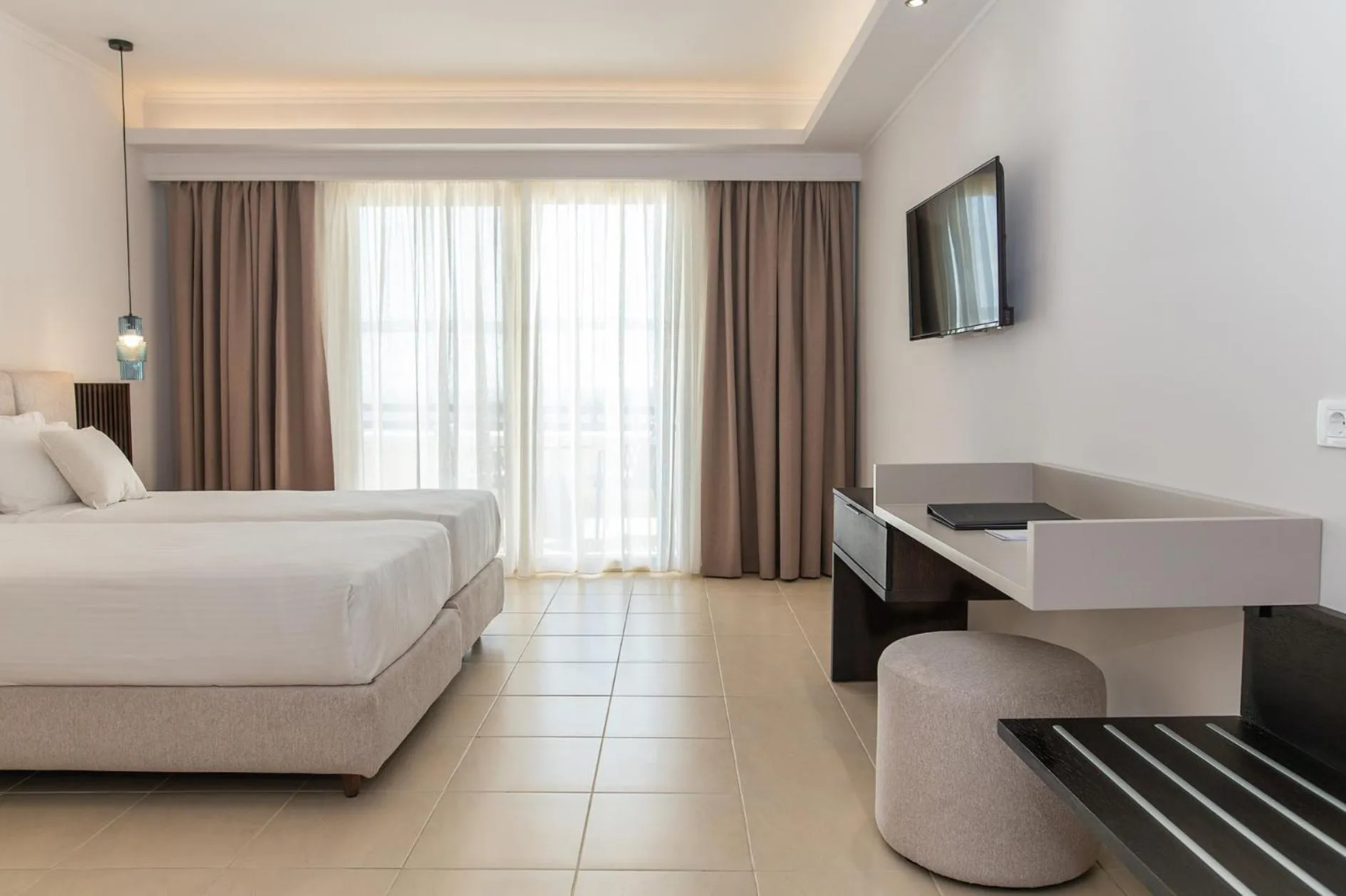 Bed in Grand Blue Beach Hotel