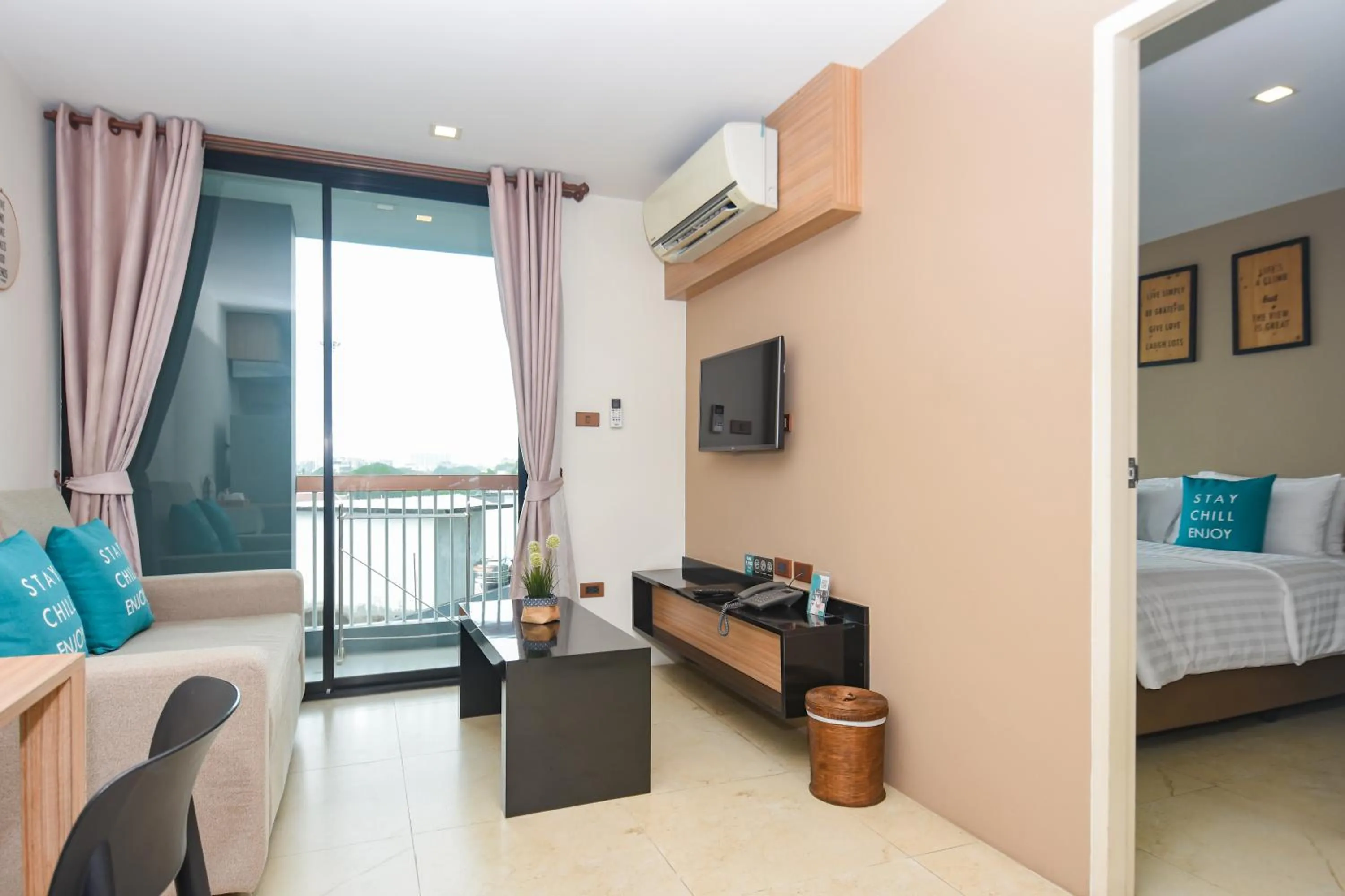 Seating area, Bed in Cross Vibe Chiang Mai Decem Nimman Hotel