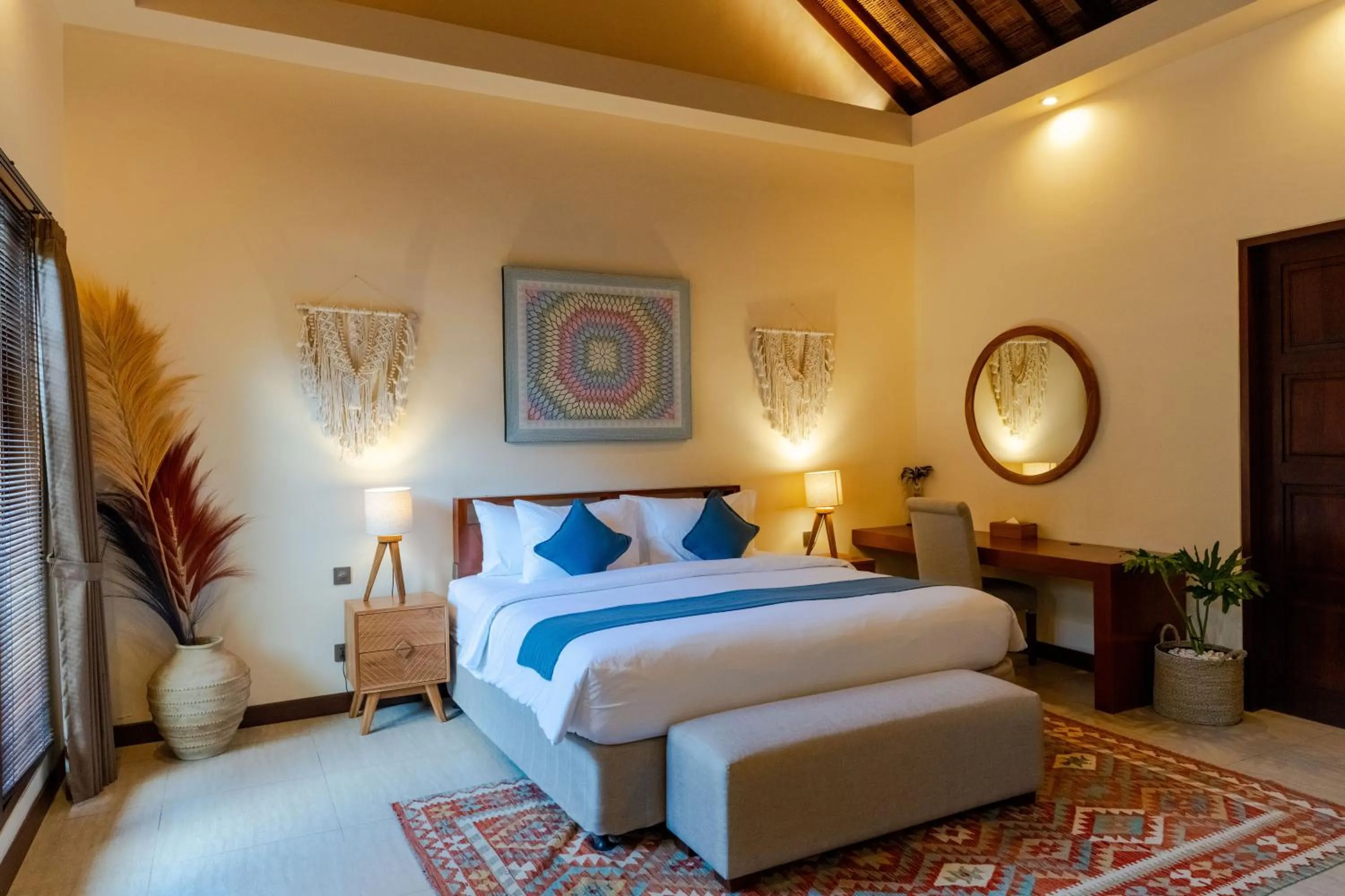 Bed in Boholuma Villas by Pertama Management