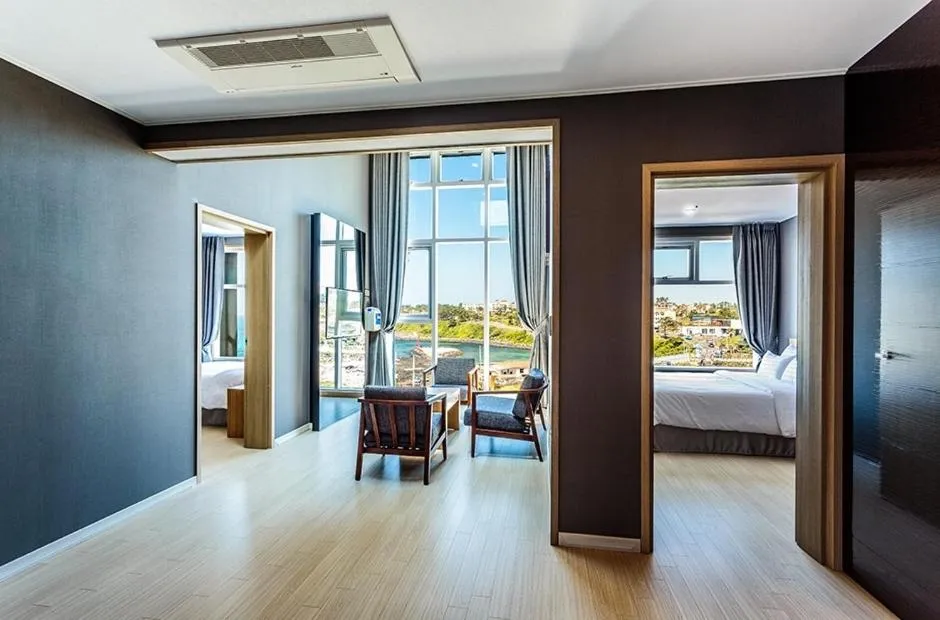 Living room, Bed in Rich Hotel