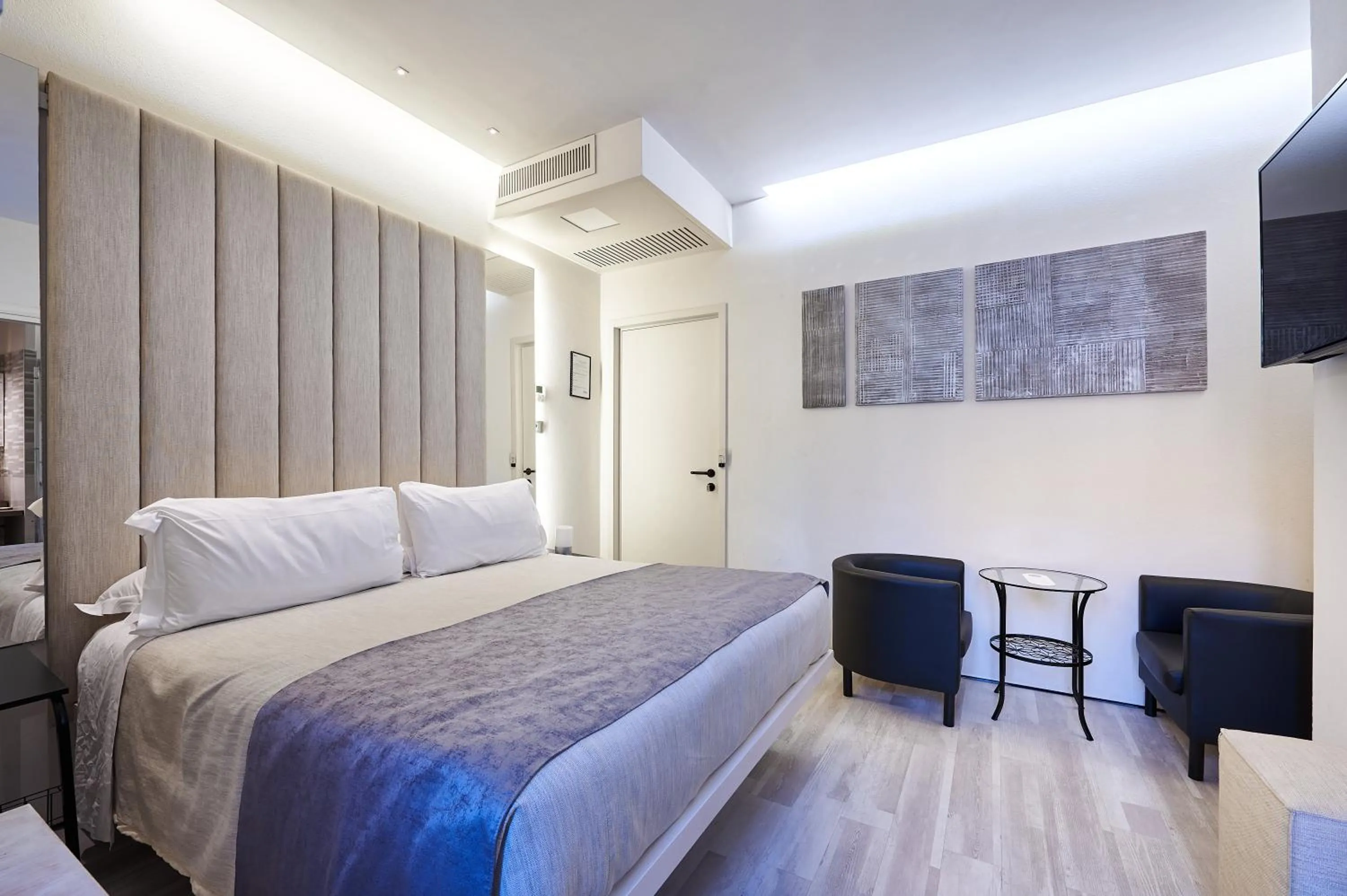 Bed in Room 230 Roma Luxury Suites