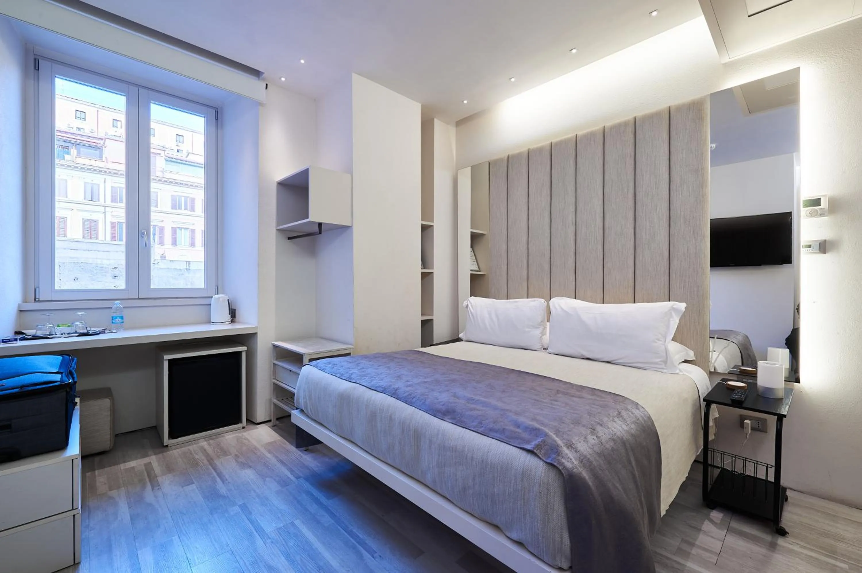 Bed in Room 230 Roma Luxury Suites